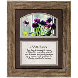 "A Sister's Memory" Framed Print - Soft purple tulips and a warm, rustic wood frame set a gentle, reflective tone for this sympathy flower arrangement alternative - a framed memorial plaque perfect for honoring a sister after loss. Intended as a sympathy or funeral keepsake, the piece pairs an arched photographic image of blooming purple tulips with the comforting poem "A Sister's Memory," offering a quiet, heartfelt way to say "I remember you" and help the person you're thinking of feel seen and held.  The framed print sits double-matted in rich dark brown and light neutral tones and is presented behind glass in a durable polyresin frame with a textured wood look. Beneath the floral photo the poem is printed in elegant script and serif type on a soft background, creating a homey, timeless display. The piece measures 10" wide by 12" high and includes a velvet easel back and triangle hanger for tabletop or wall display; artwork can be swapped to hold a 4" x 6" photograph for a personal touch.  This keepsake makes a thoughtful sympathy gift for a sister's memorial, a comforting housewarming for someone grieving, or a lasting tribute to place on a mantel or bedside table. The muted purples, mixed neutrals, and white accents keep the tone peaceful year-round, and the option to personalize with a photo ensures the recipient will have a meaningful reminder of shared memories.