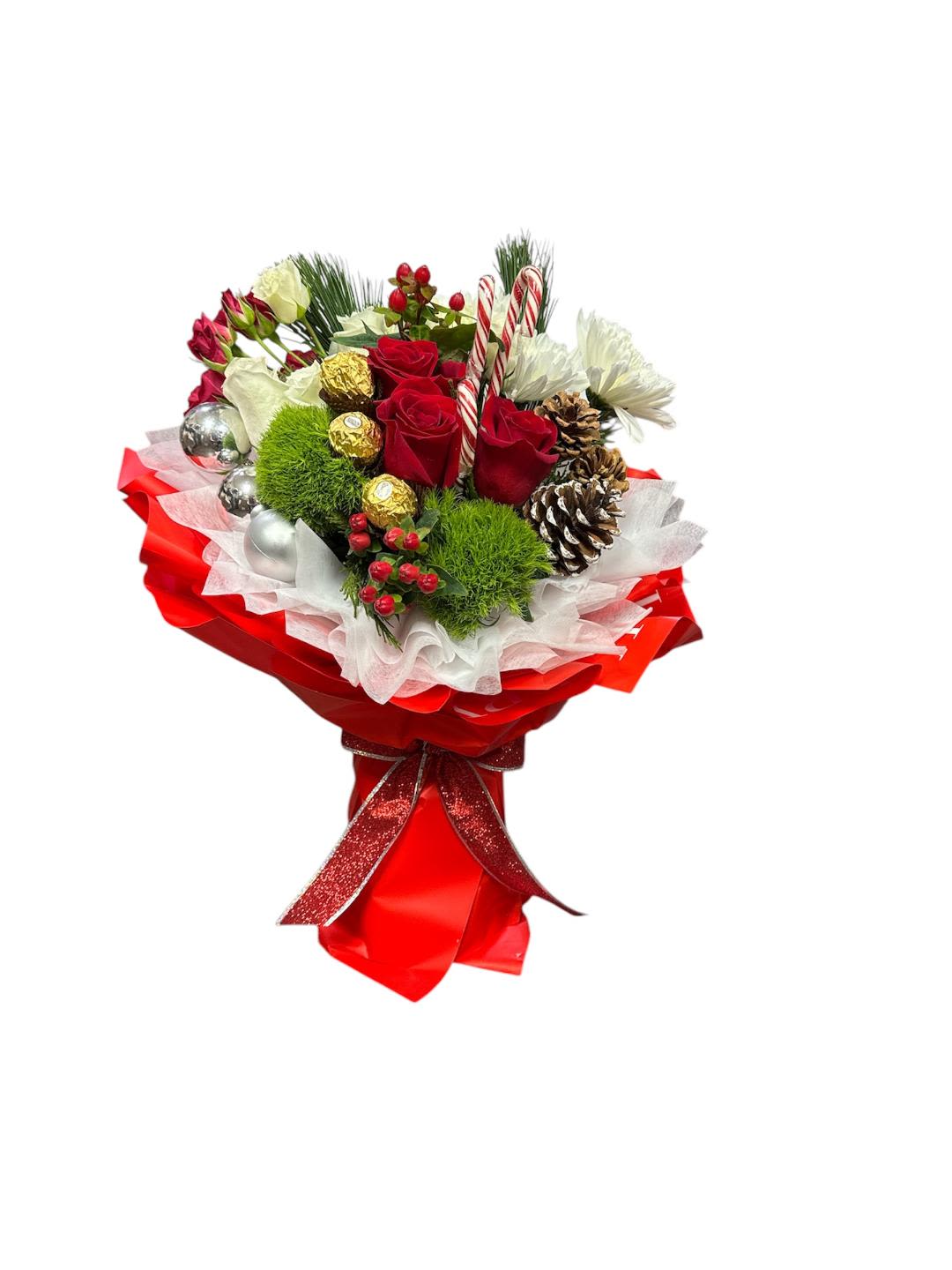 Holiday bouquet with red roses, white blooms, and candy canes