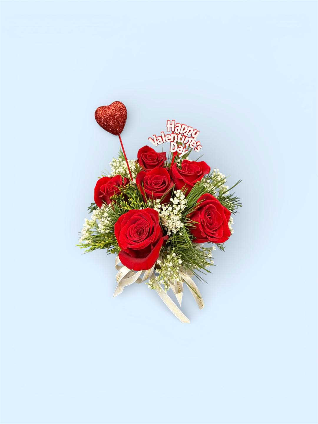 Red rose bouquet with a heart topper and Valentine's Day sign