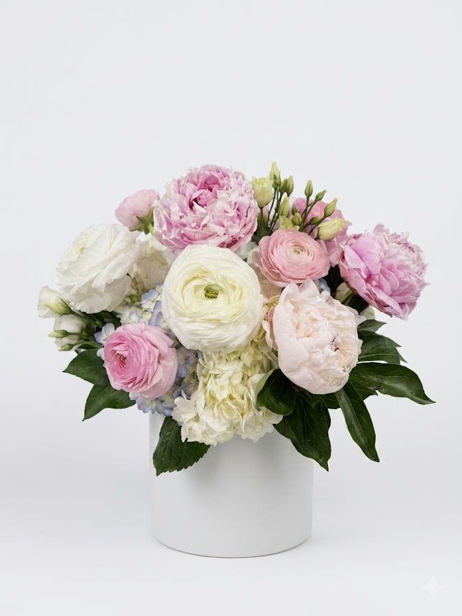 Sweet Dreams Bouquet - Ranunculus, Peonies, Snapdragons with spring flowers in a Vase Flowers that are high quality, fresh, and beautiful. While we may seasonally need to substitute for flower variety also we may sometimes need to use a different vase or different greens for sub material.