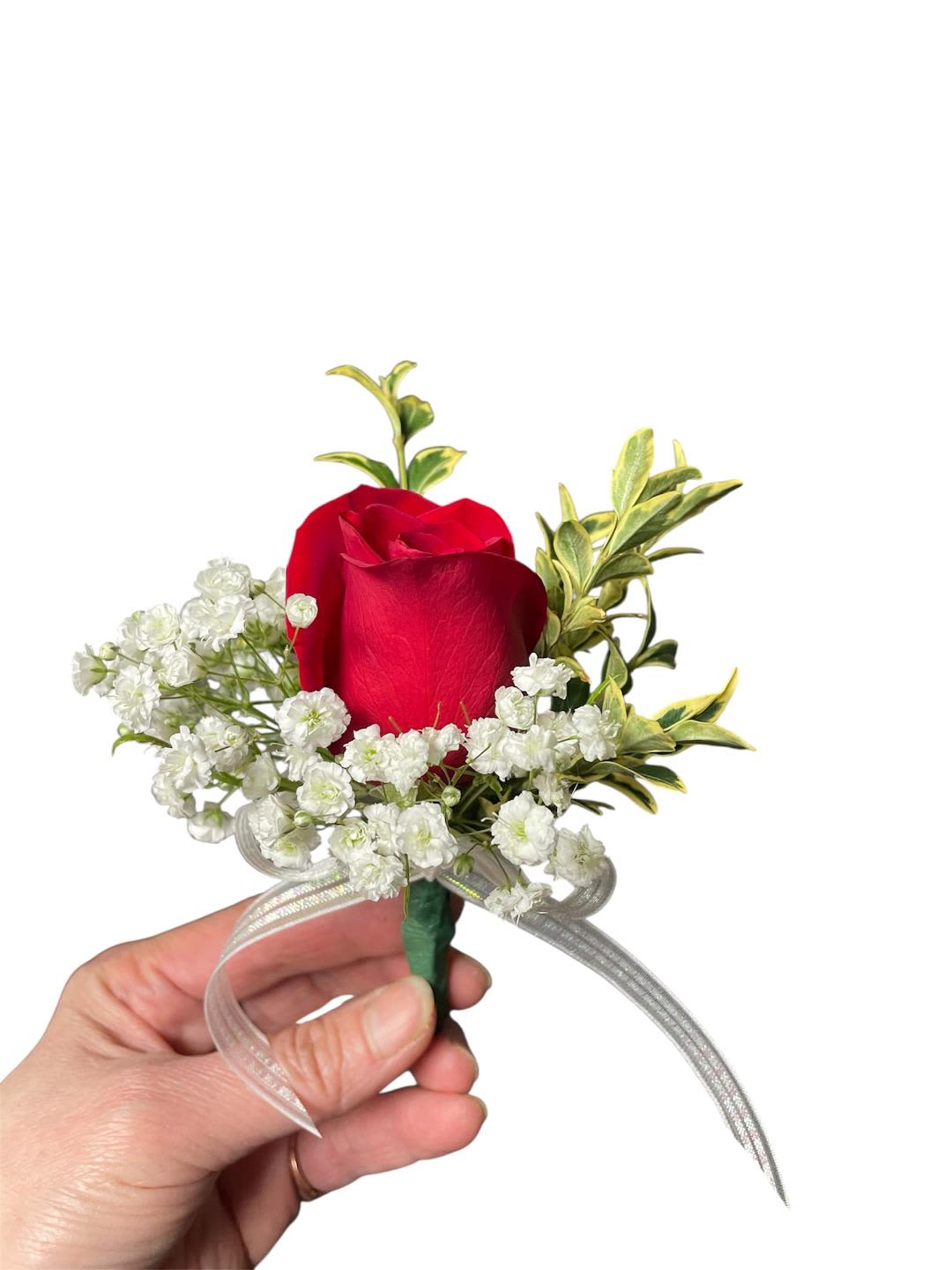 Red rose boutonniere with baby's breath and ribbon