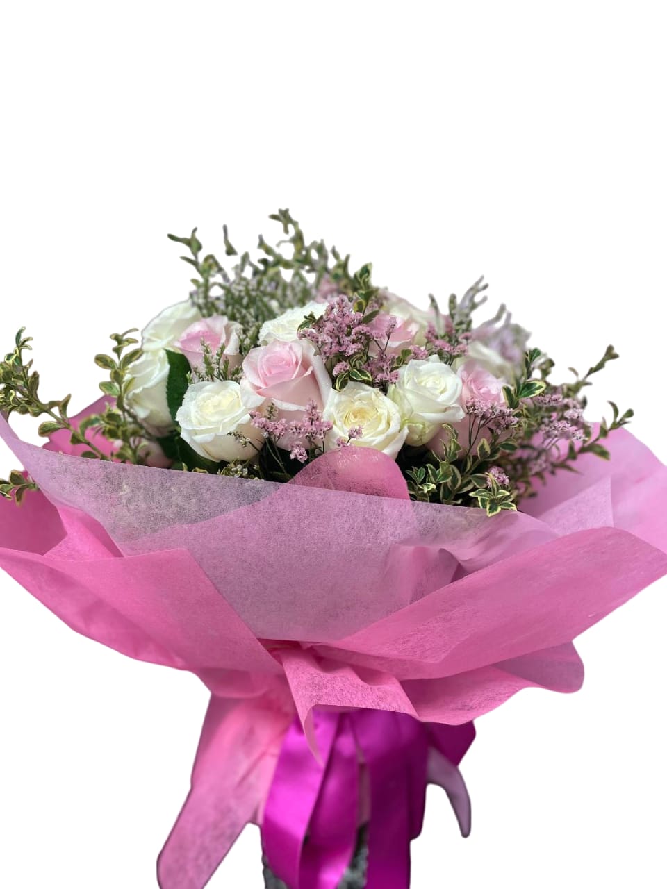 Pink and white rose bouquet wrapped in bright pink paper