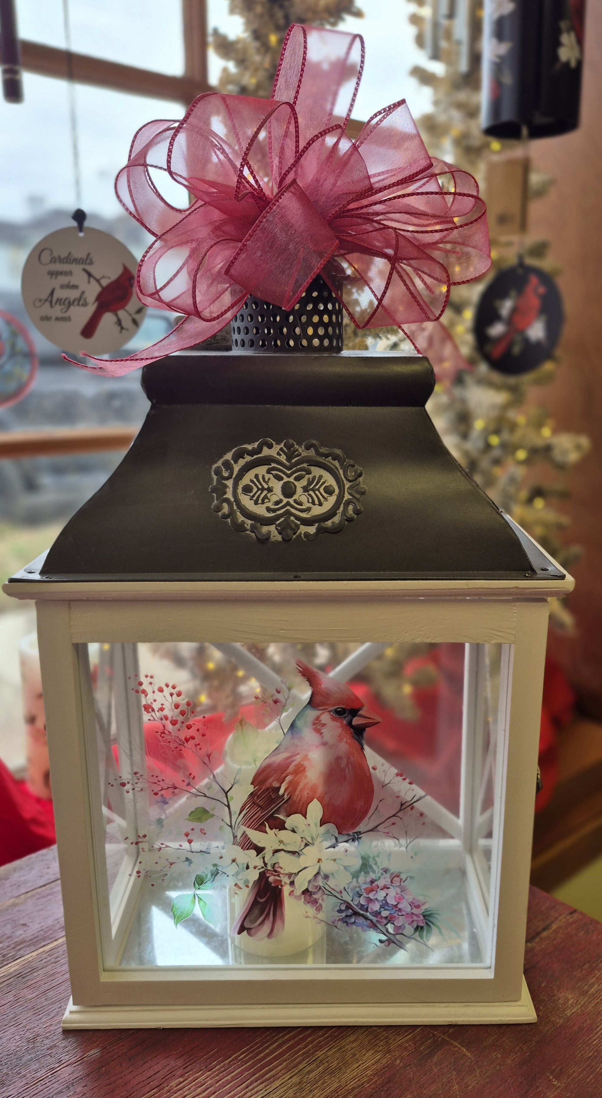 Red Cardinal Lighted Lantern - Beautiful but simple Red Cardinal lighted lantern is a wonderful lantern to send for sympathy, just because or someone who just loves cardinals. Comes with a led battery powered candle ( batteries included ).   22" Tall 12 1/2" Wide  