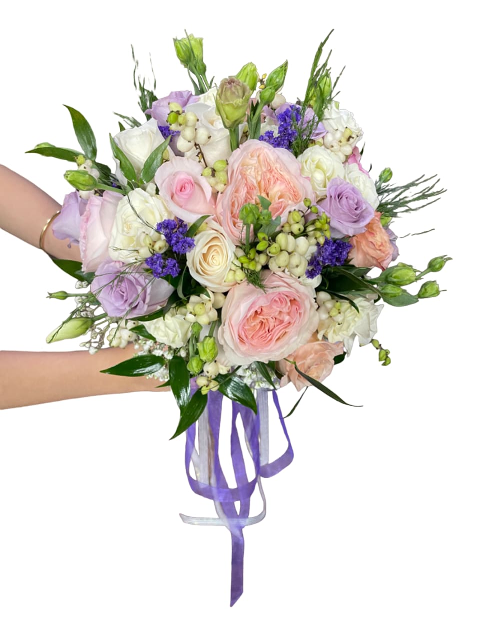Hand-tied bouquet of pastel roses and purple flowers with ribbon tails