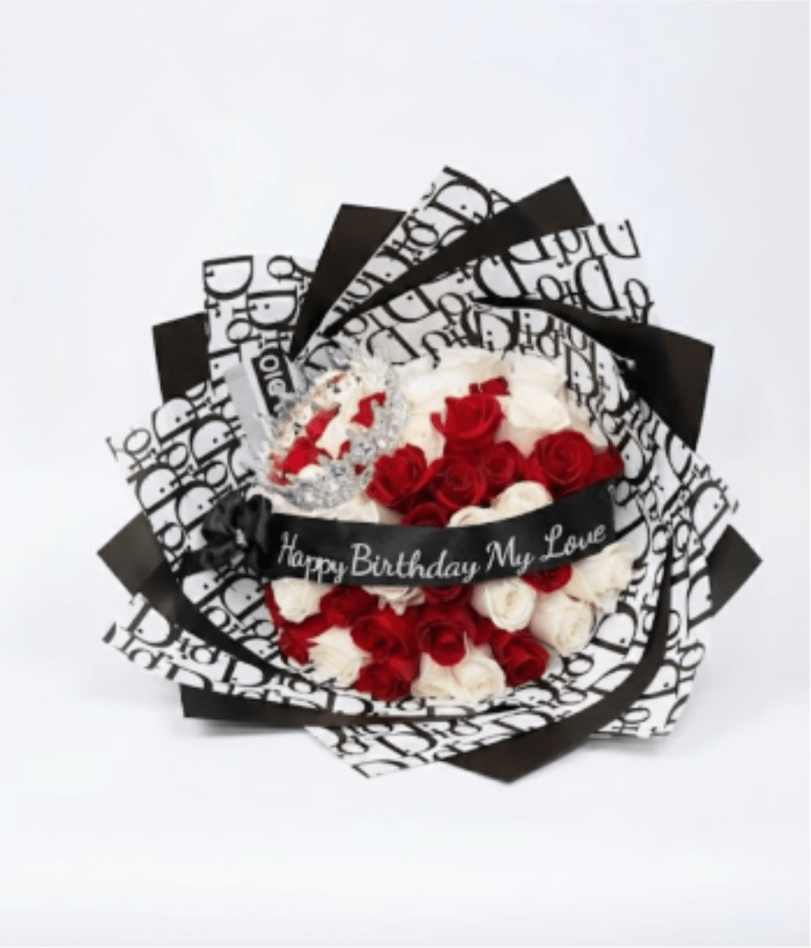 Red and white rose bouquet wrapped in black-and-white paper
