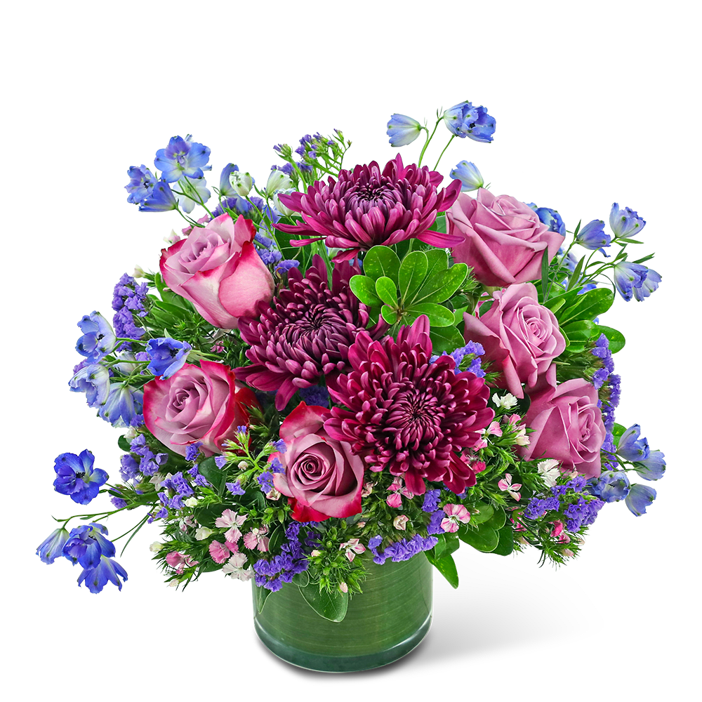 Ultraviolet Dream - Ultraviolet Dream is a captivating floral arrangement featuring Roses, Cremones, Dianthus, Delphinium, and premium foliage in a leaf-lined vase. With its vibrant purple blooms and lush green colors, this enchanting design adds a touch of elegance to any space and is the perfect gift for any occasion.