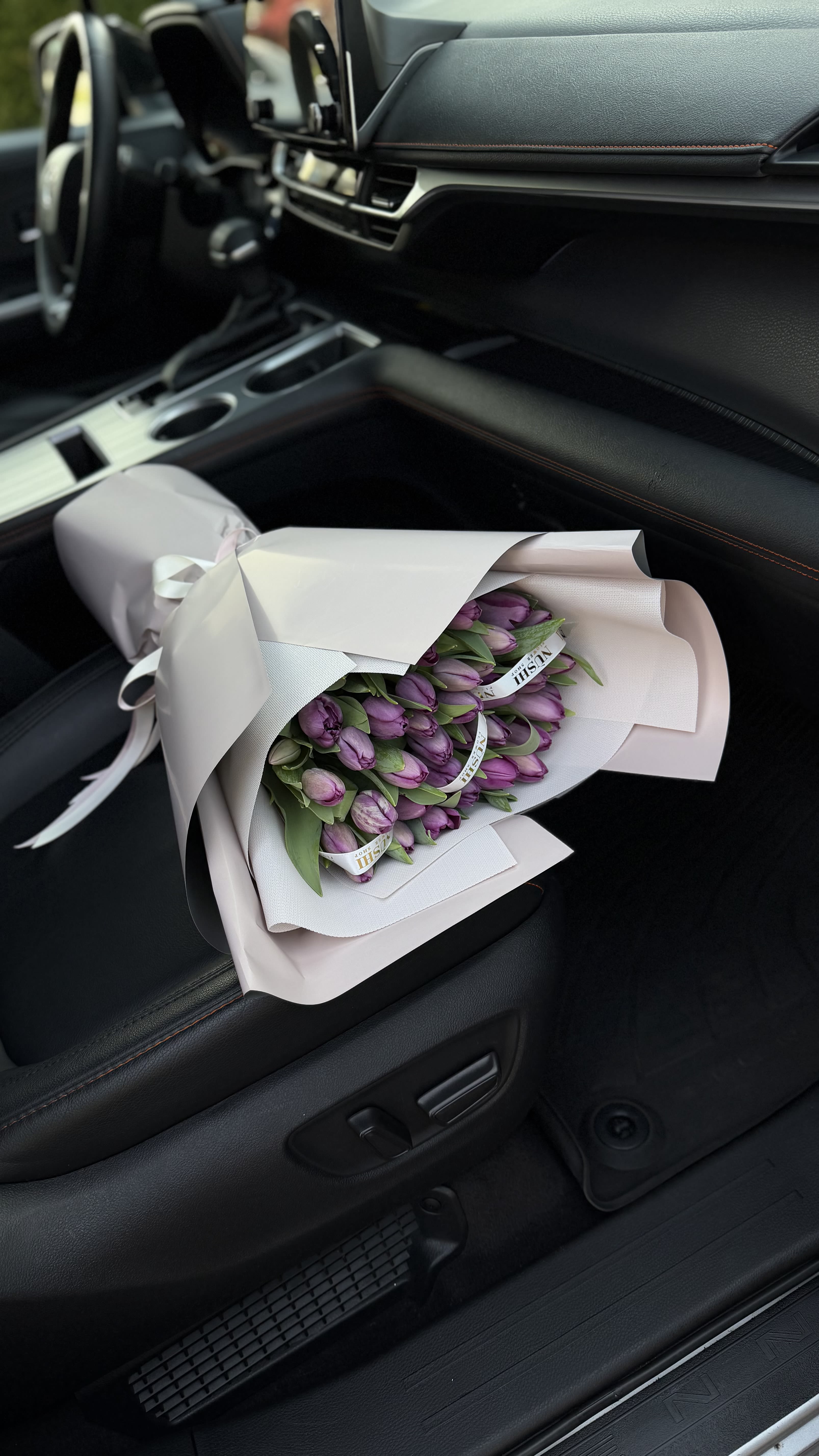Elegant Tulip Arrangement - A fresh and vibrant tulip arrangement, carefully designed to match the original style. Presented in a similar vase due to availability, while maintaining the same beauty, color harmony, and overall look.