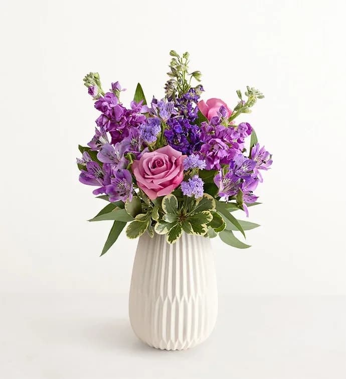 Lavender Expressions - Send a sweet, thoughtful expression with our everyday bouquet. Hand designed by our florists, this garden-inspired gathering features soothing lavender and purple, along with accents of cascading greenery. It’s arranged in our keepsake White Modern Vase, with a tapered design and matte finish that complements the beauty of every bloom.