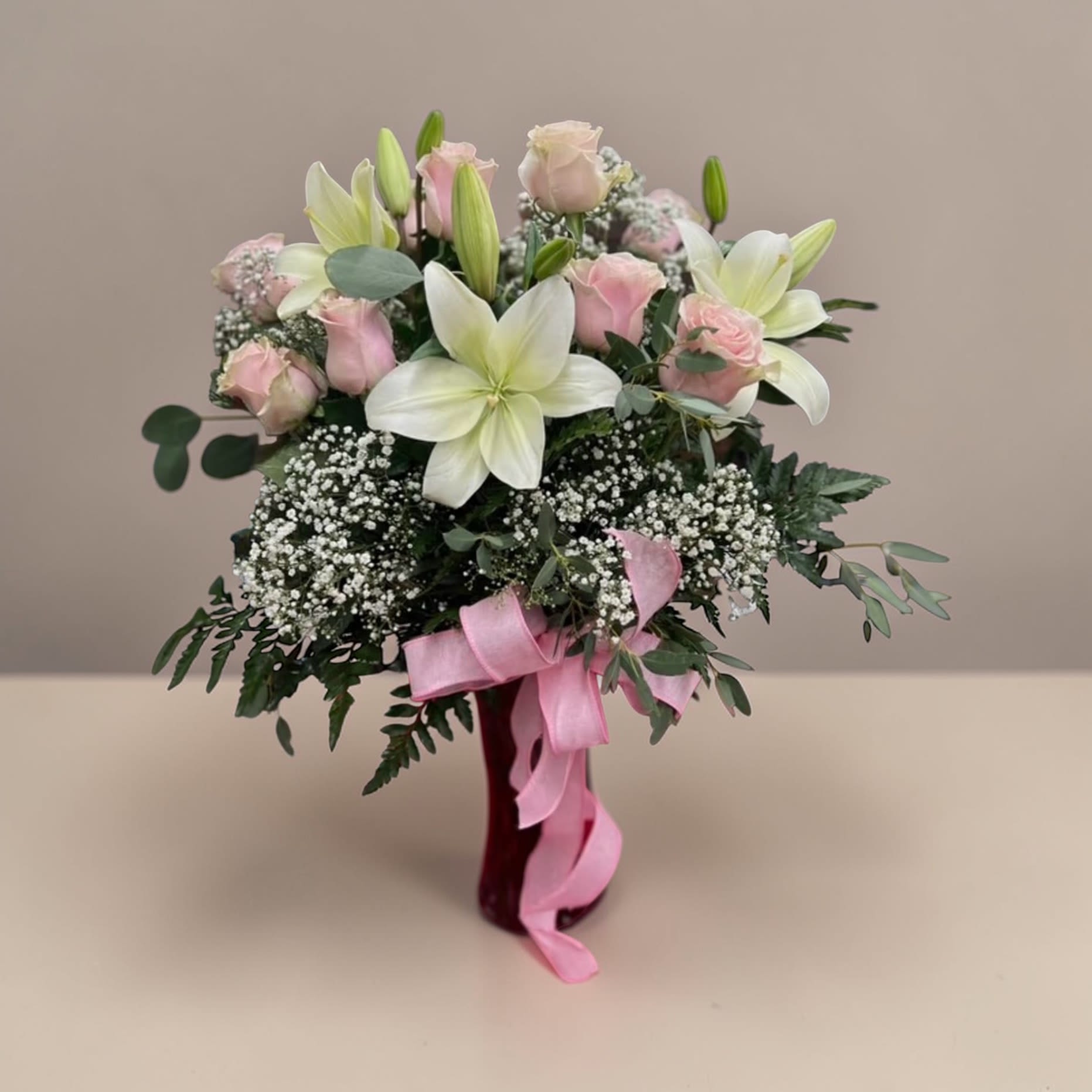 Rose lily by Daisy   - Roses, Lilly’s in Glass vase please choose color of roses  red, pink, white, yellow, purple. sometime your lilies will be closed do to the freshness. 9 rose 3 lily's.