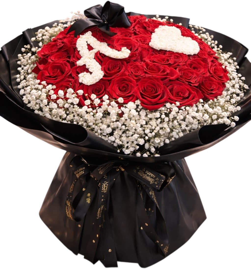 Red rose bouquet with white floral lettering and a black ribbon wrap