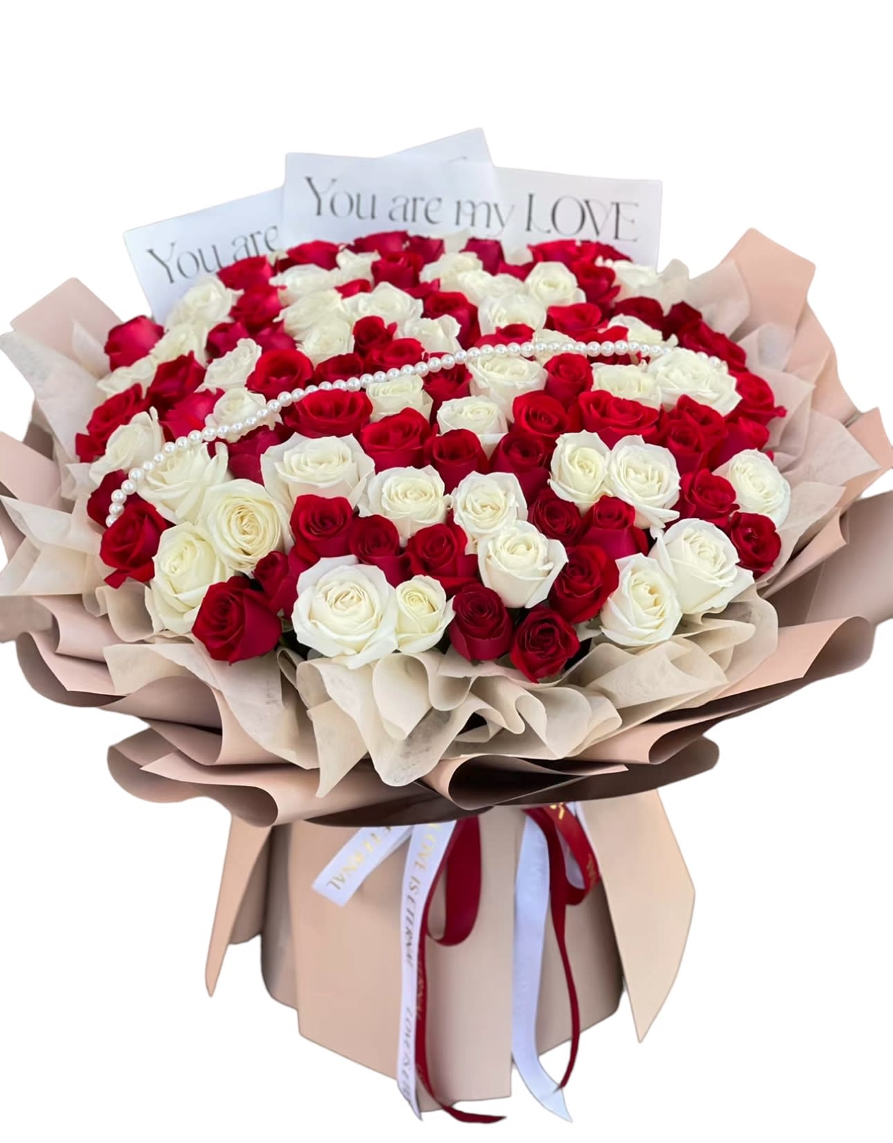 Bouquet of red and white roses with a pearl strand and love cards