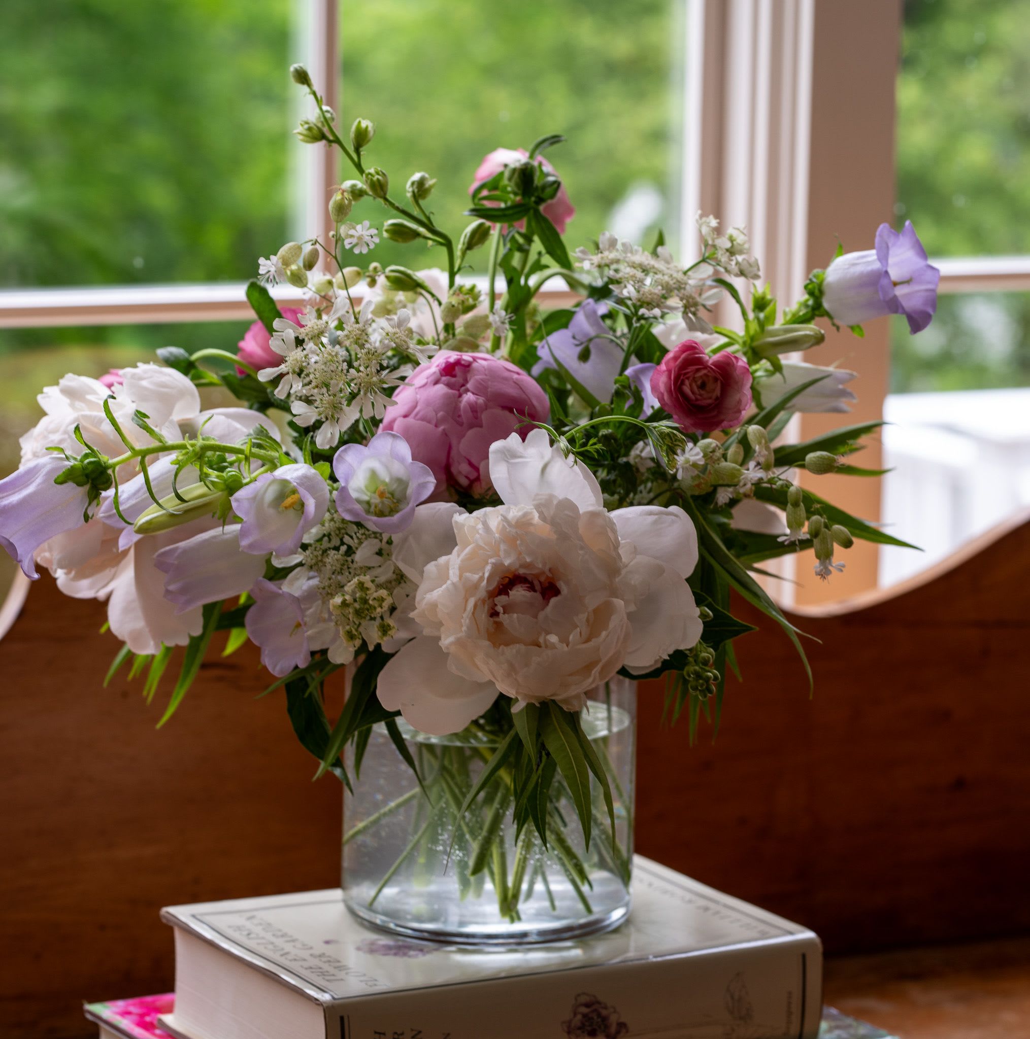 Mother's Day  - Spring peonies, campanula, ranunculus as well as sweet peas in a soft color palette.  Plenty of movement and dimenstion grace this beautiful spring garden bouquet.  