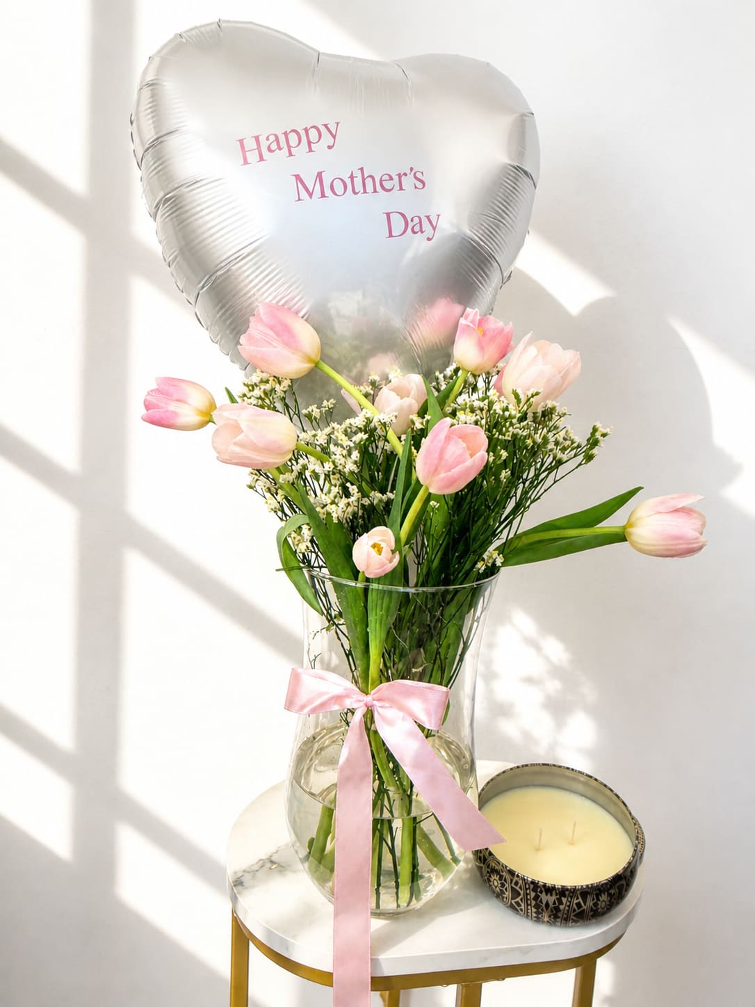 Mother’s Day Gift Set - Elegant and timeless   A beautiful arrangement of fresh pink tulips in a glass vase, paired with a “Happy Mother’s Day” balloon and a luxury scented candle — the perfect gift for any special moment.   Fresh tulips  Glass vase arrangement  Mother’s Day balloon  Luxury scented candle   Same-day flower delivery in Myrtle Beach (order before 12PM)  * Balloon color may vary in shades of pink or white based on availability.