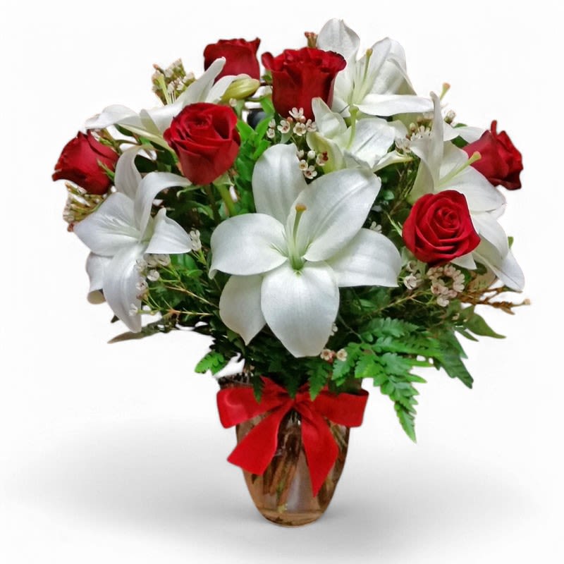"Lily Kiss" - Red Roses and White Lilies - Beautiful red roses paired with white lilies make for a stunning combination. The "Lily Kiss" arrangement passion, romance and love... . Fits perfectly on an office desk, entry or coffee table.   