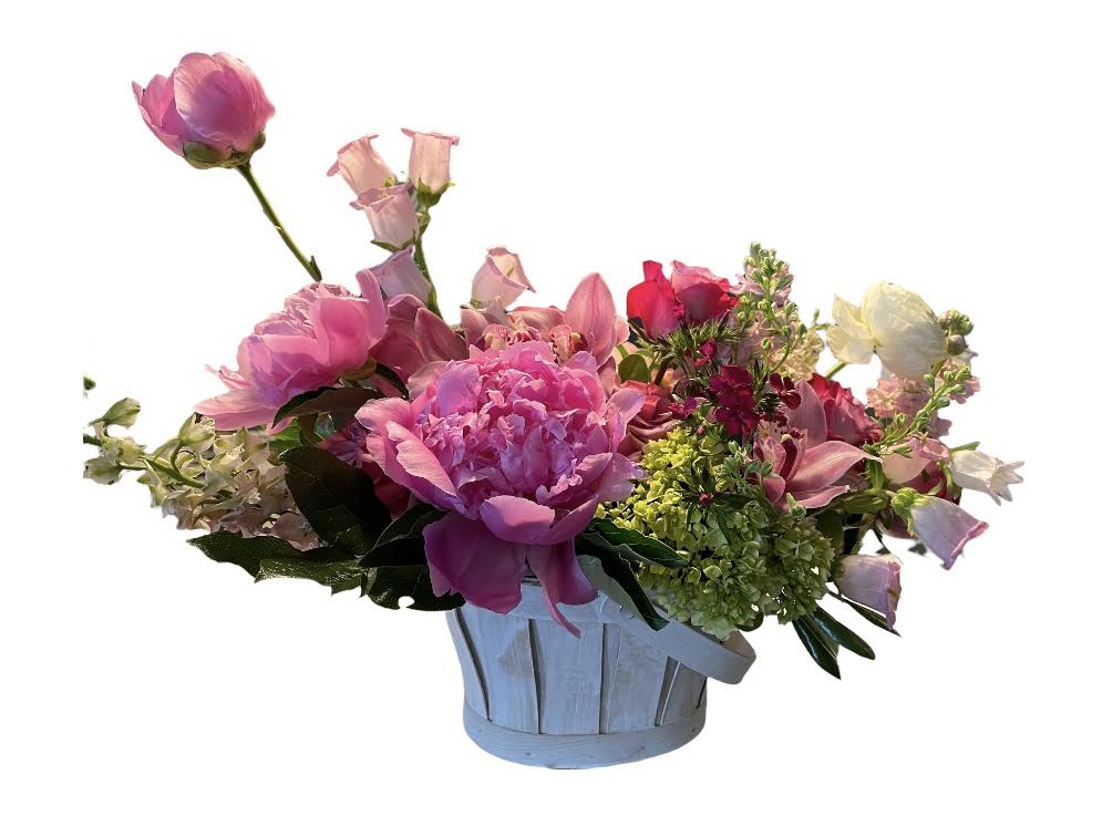 Pink and white mixed flower arrangement in a light blue basket