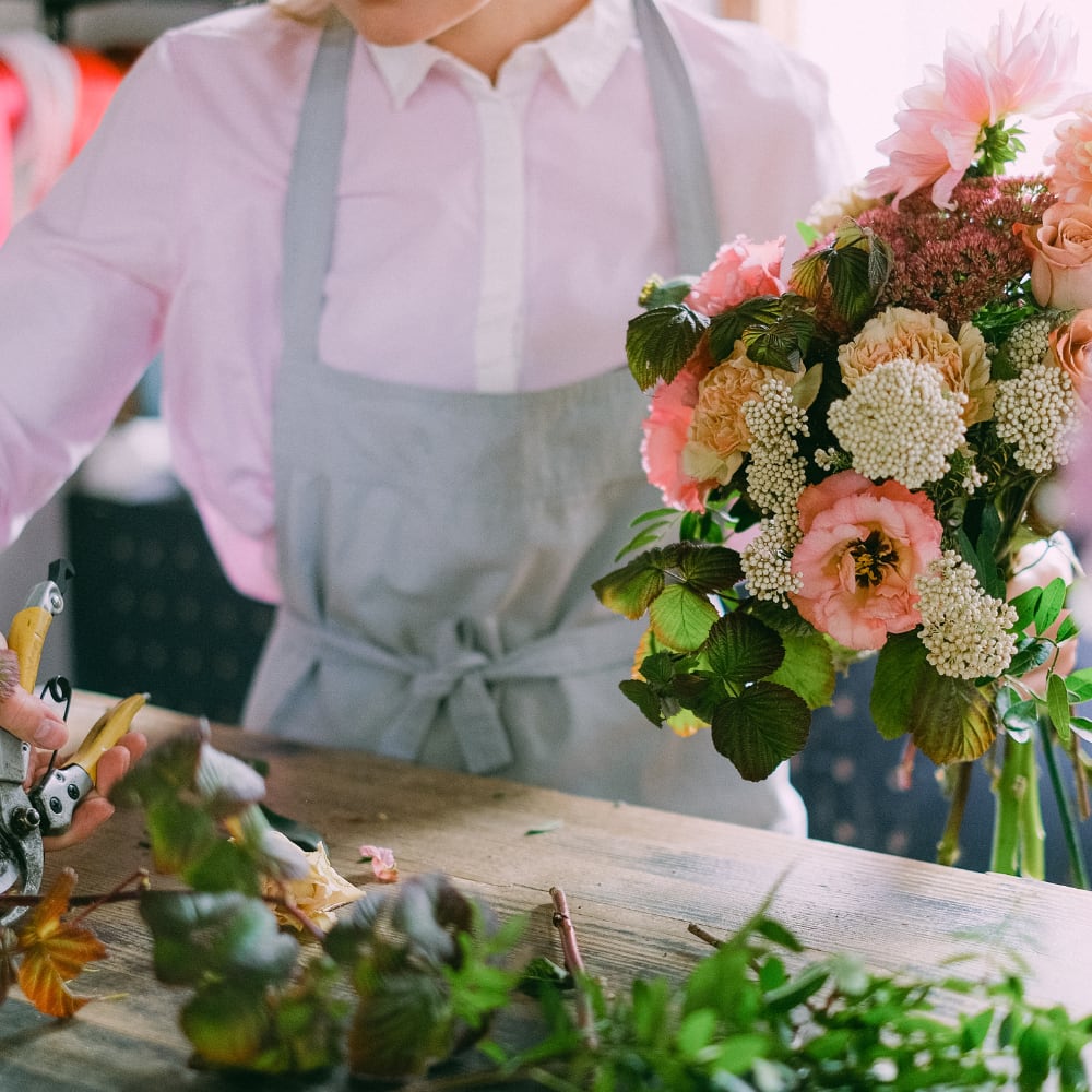 Pink and peach floral bouquet with white clustered blooms