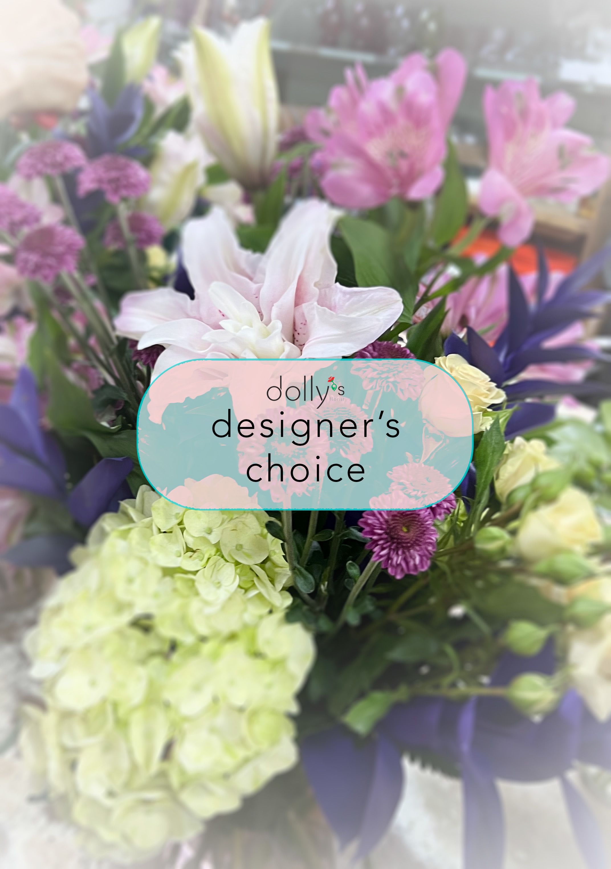 Deluxe | Designer's Choice - While customer input is not accepted for this arrangement, we guarantee a beautiful and thoughtfully crafted design. Our designers will create a bouquet with the freshest blooms of the season. Please note that flower selections are made exclusively by our designers, based on current stock. 