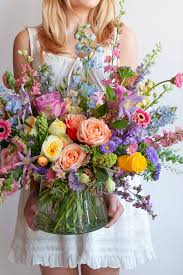 Mother’s Day Designer's Choice Arrangement - A "Designer’s Choice" arrangement is a floral design that allows the florist or designer to use their creativity and expertise to select and arrange flowers based on their aesthetic judgment, seasonality, and the recipient’s needs. The customer typically provides a general idea of color scheme or style preferences, but the designer has the freedom to choose the flowers, textures, and overall look of the arrangement.
