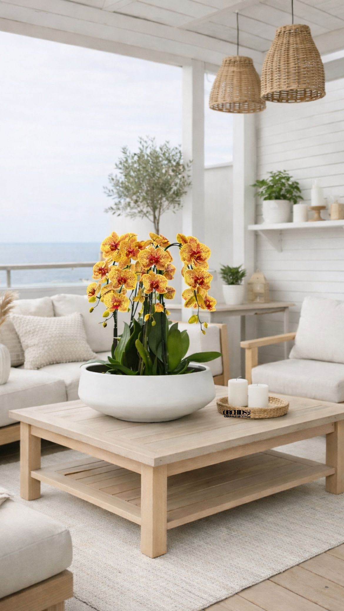 Yellow orchids arranged in a white bowl on a coffee table