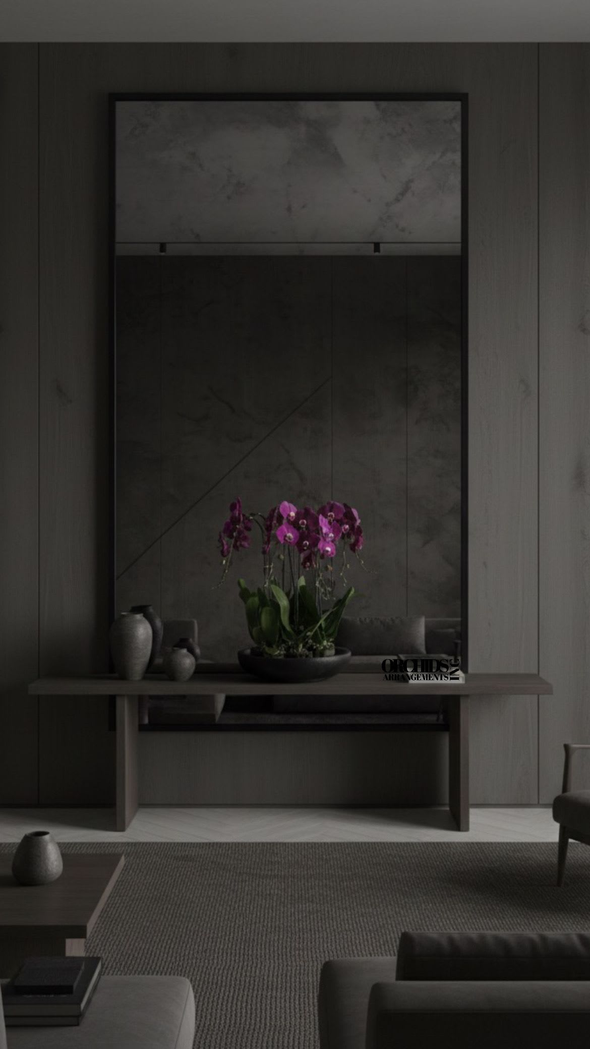 Potted purple orchids arranged on a low table in a dark room