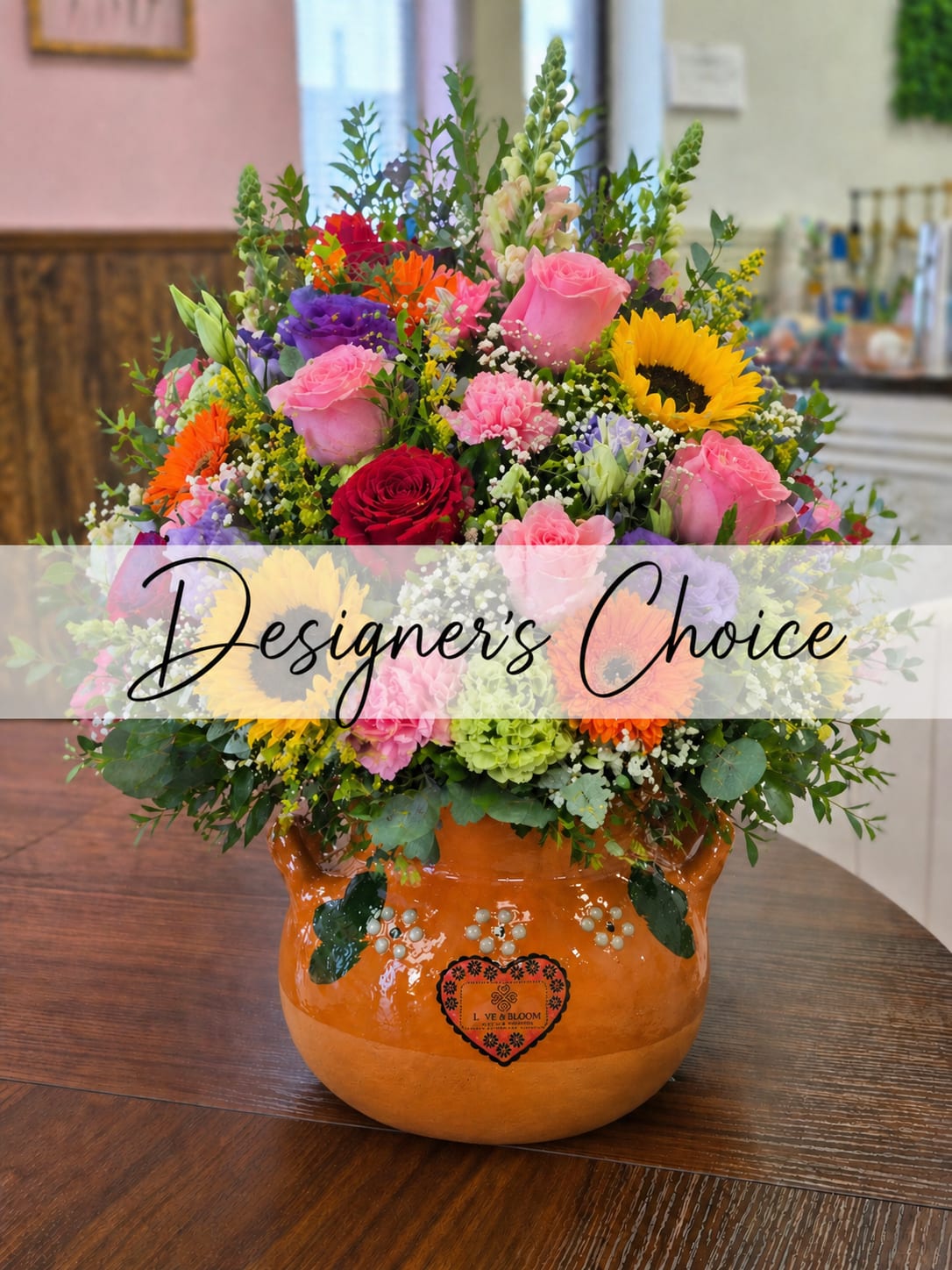 Designer's Choice Ollita - Designer’s Choice Arrangement   Celebrate the special women in your life—Mom, Grandma, Aunt, or any beautiful role model—with our Designer’s Choice arrangement. Each bouquet is thoughtfully created using a fresh, seasonal variety of flowers, making every design one-of-a-kind and full of love.  Designed in a traditional handcrafted clay Ollita pot, this arrangement adds a warm, timeless, and cultural touch that can be cherished long after the flowers. Please note: Flowers and colors will vary as our designers select the freshest blooms available, ensuring a unique and beautiful arrangement every time. Perfect for Mother’s Day or any occasion when you want to show appreciation and love   Available for local delivery, pickup, or walk-in orders in Dodge City and surrounding areas.                     Mother’s Day flowers Dodge City, florist Dodge City KS, Designer’s Choice bouquet, flower delivery Dodge City, same-day flower delivery Dodge City, local florist near me, Mother’s Day gifts Dodge City, flower shop Dodge City Kansas, Ollita flower arrangement, clay pot flower arrangement, handcrafted pot flowers Dodge City, rustic flower arrangement Dodge City, fresh flower arrangements Dodge City, pickup flowers Dodge City, walk-in florist Dodge City, send flowers to mom Dodge City, floral delivery near Dodge City KS, best florist in Dodge City