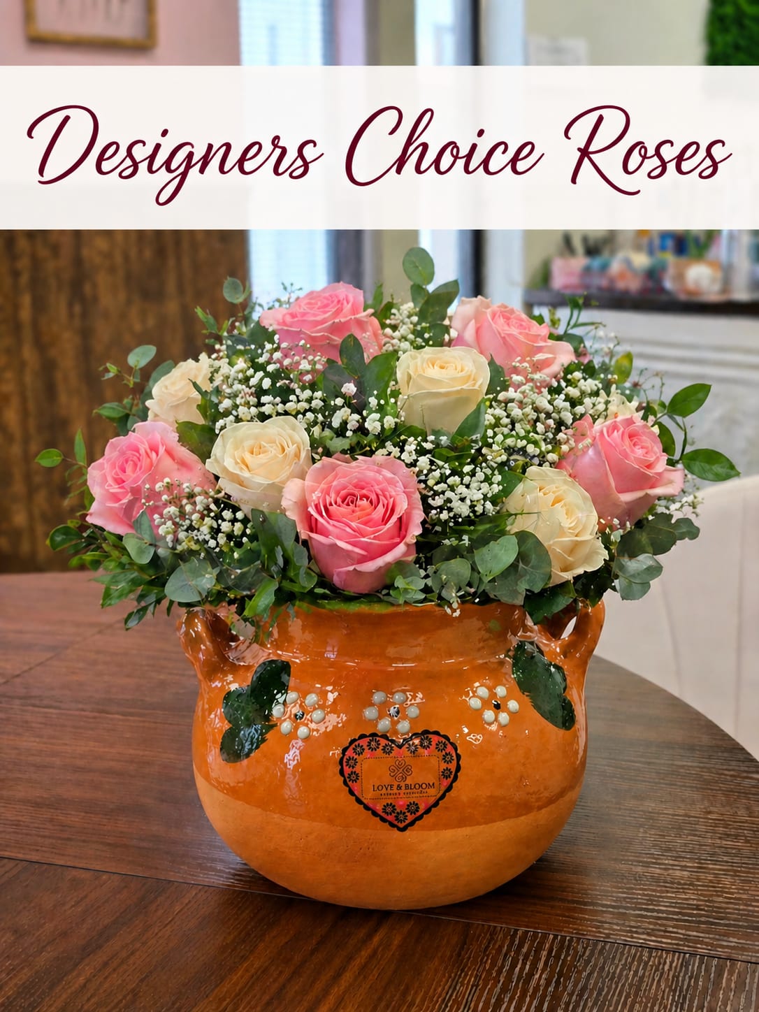 Love&amp;Bloom Ollita - Designer’s Choice Roses – Mother’s Day  Celebrate Mom with something truly special  Our Designer’s Choice Roses arrangement is a one-of-a-kind creation featuring a beautiful mix of fresh roses in soft, elegant tones—designed with love by our florists. Each arrangement is styled in a traditional handcrafted Ollita clay pot, adding a warm, meaningful, and cultural touch that Mom can cherish long after the flowers. Because this is a Designer’s Choice, rose colors and varieties will vary, making every arrangement unique and thoughtfully made just for her.  Perfect for Mom, Grandma, Aunt, or any mother figure in your life  Available for Mother’s Day delivery, pickup, or walk-in orders in Dodge City and surrounding areas.                 Mother’s Day roses Dodge City, Mother’s Day flowers Dodge City KS, send flowers to mom Dodge City, rose arrangement for mom Dodge City, florist Dodge City Kansas, flower delivery Dodge City KS, same day Mother’s Day delivery Dodge City, Ollita flower arrangement, clay pot flowers Dodge City, local florist Dodge City KS, Mother’s Day gift ideas Dodge City, fresh roses Dodge City, pickup flowers Dodge City, walk-in florist Dodge City