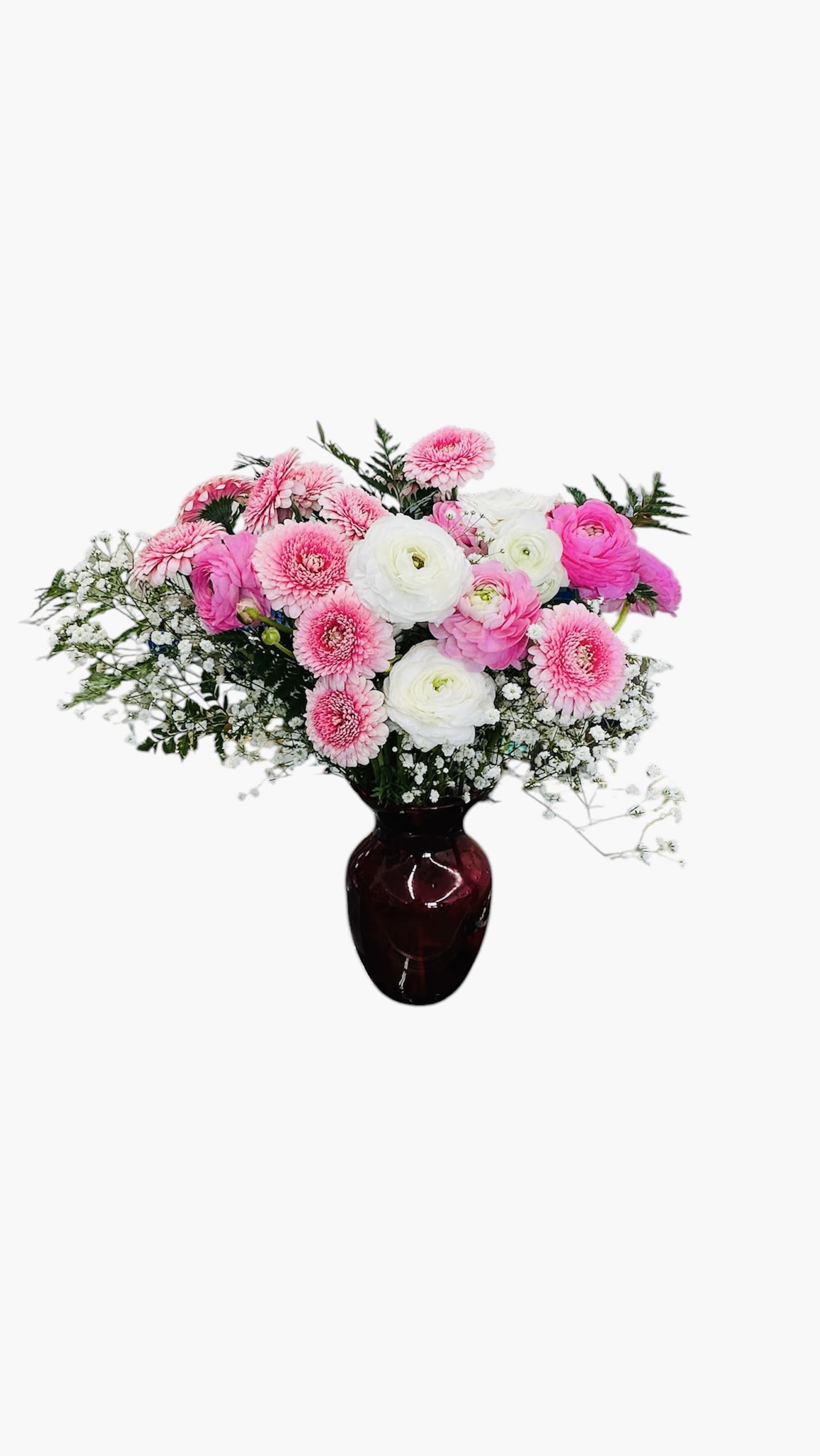  Blushing Beauty - This soft and charming arrangement features pink gerberas, white ranunculus, pink ranunculus, and delicate baby’s breath, all in a deep maroon vase. It blends elegance with a touch of whimsy—perfect for brightening someone’s day.