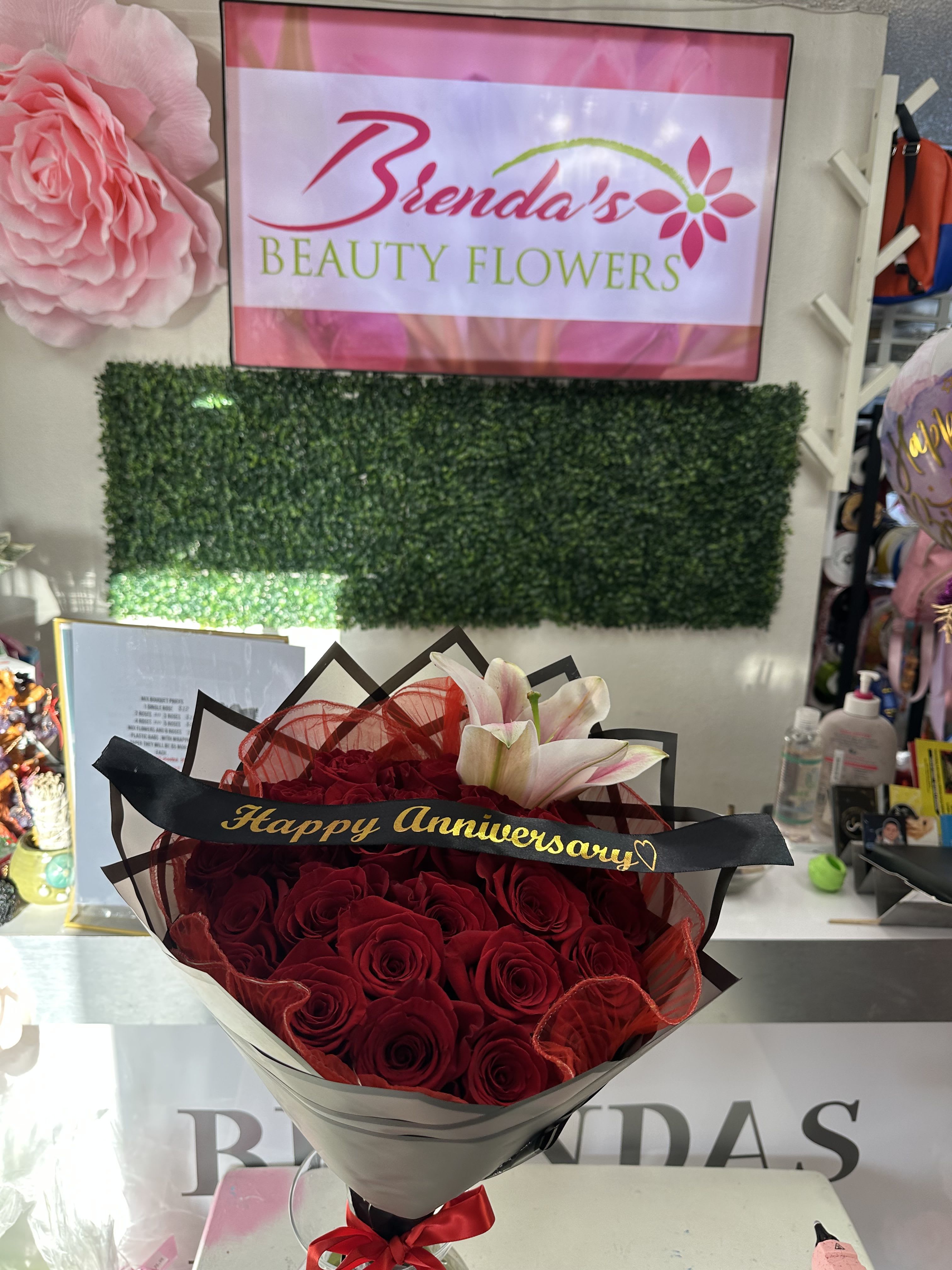 Sweet Elegance  - Red roses with a beautiful lily centerpiece  Standard size 25 roses 1 lily  Deluxe 36 roses 2 lilies  Premium 50 Roses 3 lilies  Soft, elegant, and perfect for any occasion  Birthdays, anniversaries, or just because   Custom ribbon available (let me know in the instructions what message on the ribbon )   Pickup or Uber Delivery available  Also on DoorDash &amp; Uber Eats (Brenda’s Beauty Flowers)   www.brendasbeautyflowers.com  323-420-9151  7414 S Central Ave, Los Angeles, CA y 