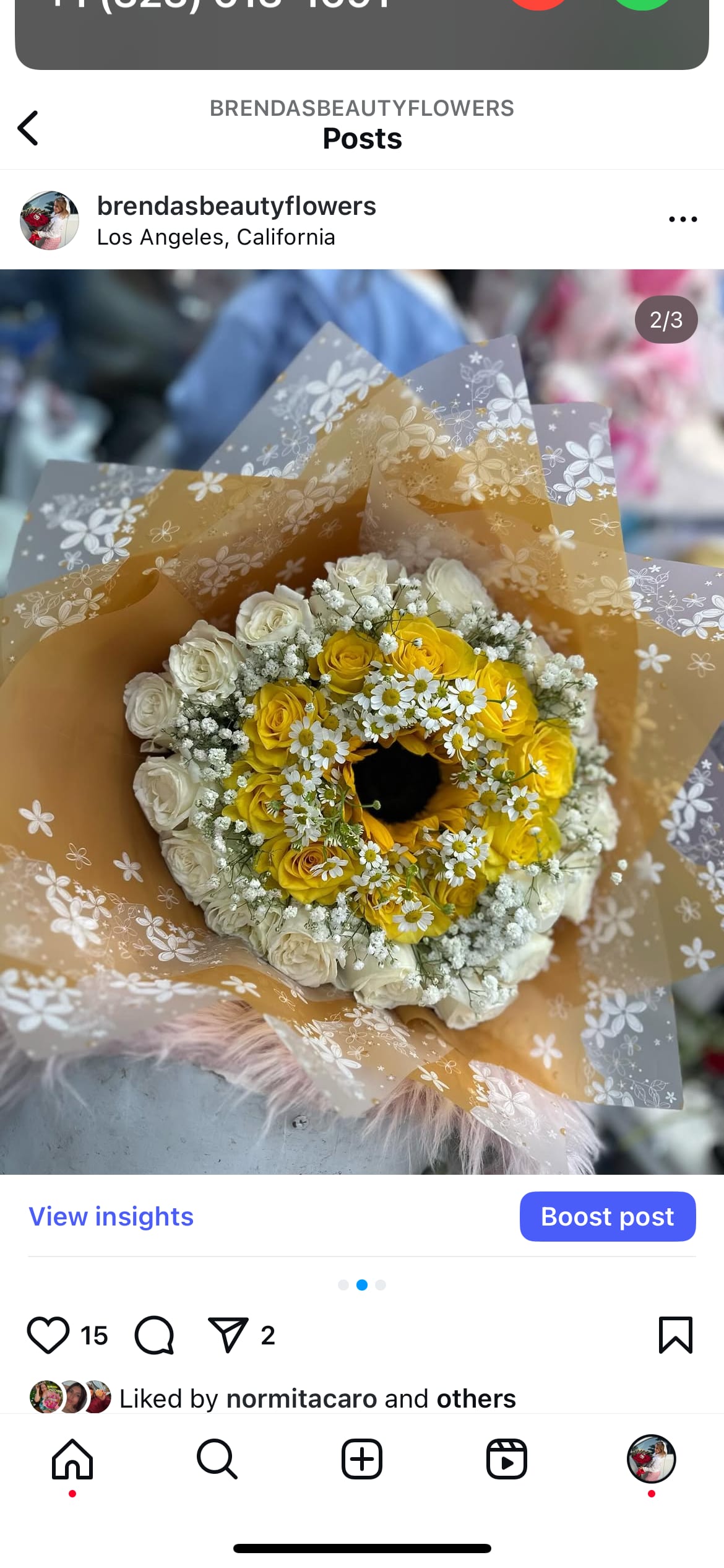 Yellow and white rose bouquet with small white daisies in floral wrap