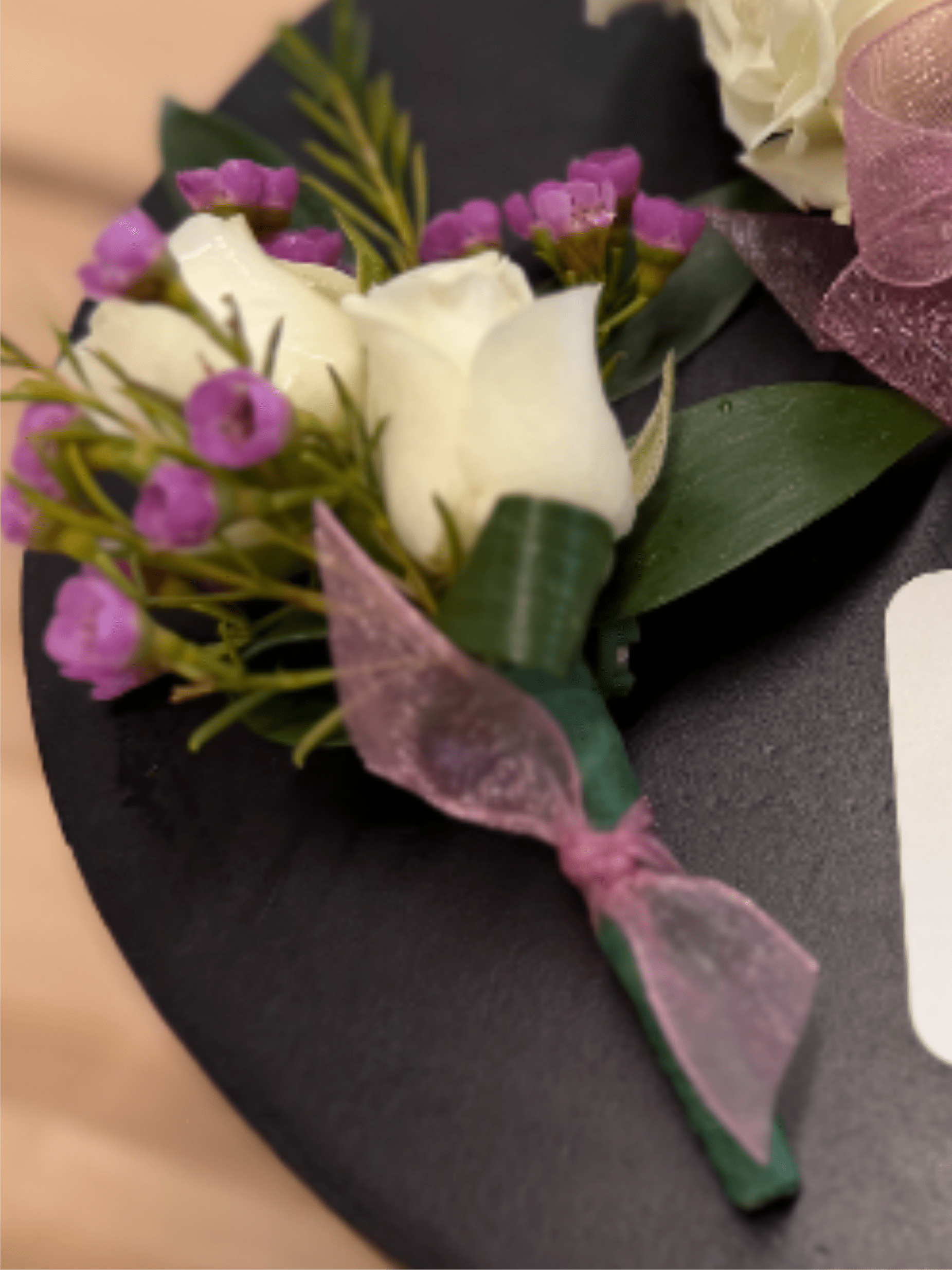 Boutonniere - 2 spray rose with ribbon knot - A classic red rose boutonnière that compliments any suit. Perfect for prom, formal or wedding events.