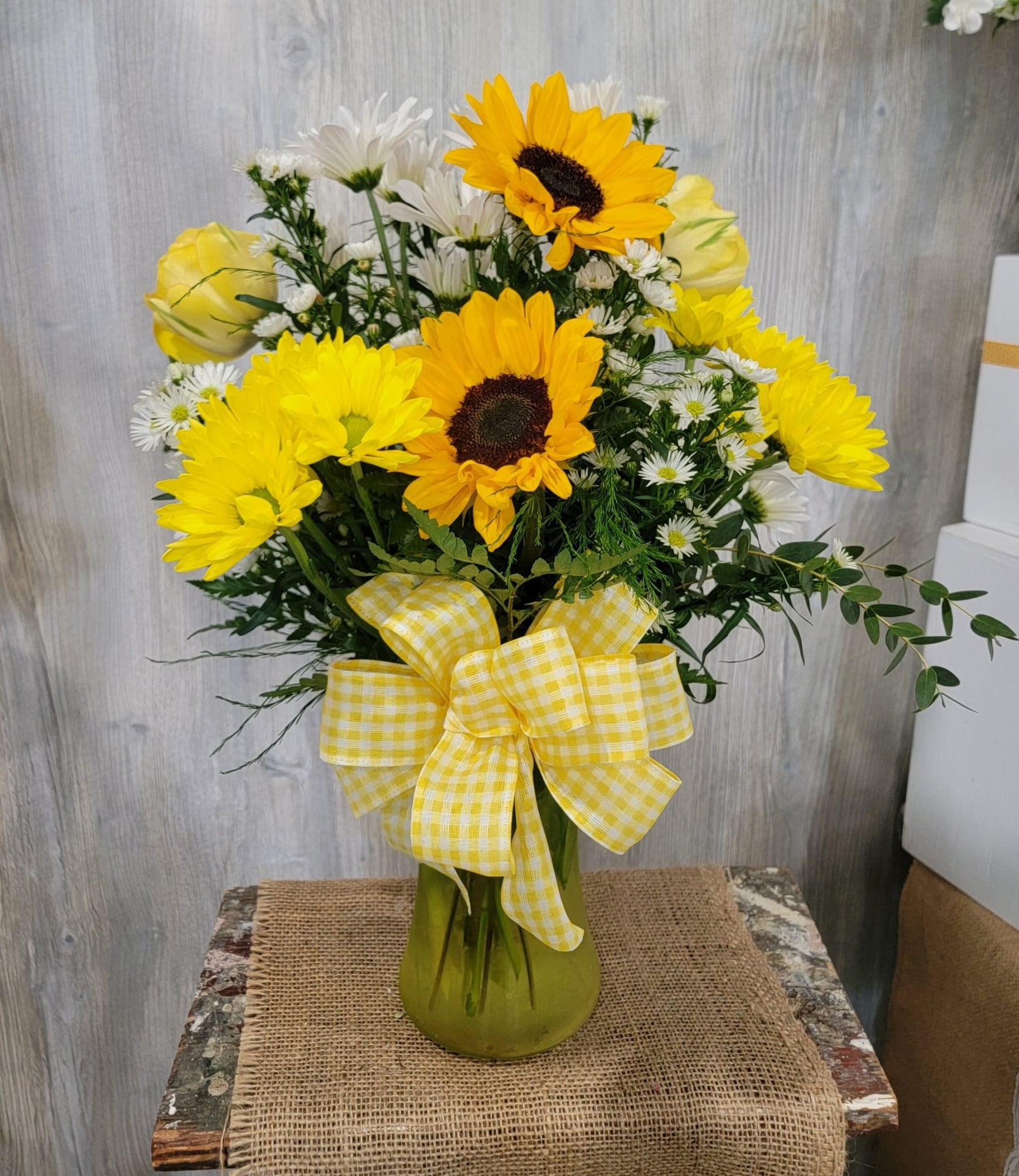 Brightside  - Vase arranged with sunflowers, yellow daisies, and yellow tulips (tulips available in the spring time only). 