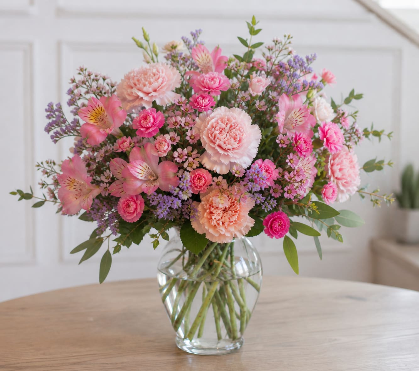 Soft &amp; Romantic - Mother’s Day Edition - Let us create something beautiful for Mom!  Our Soft &amp; Romantic Designer’s Choice arrangements are designed in a delicate palette of blush pinks, soft peaches, creamy whites, and gentle pastel tones. Using the freshest seasonal blooms, each arrangement is thoughtfully crafted in a lush, garden-inspired style with soft movement and elegant texture.  Perfect for a classic and heartfelt Mother’s Day gift, this design feels timeless, feminine, and full of love.  Choose your preferred size, and we’ll take care of the rest.  Flowers and exact varieties will vary based on availability while maintaining the overall color palette and style. Photo shown reflects our Signature size.