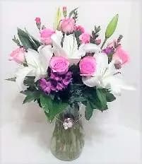 Pink and white mixed bouquet in a glass vase