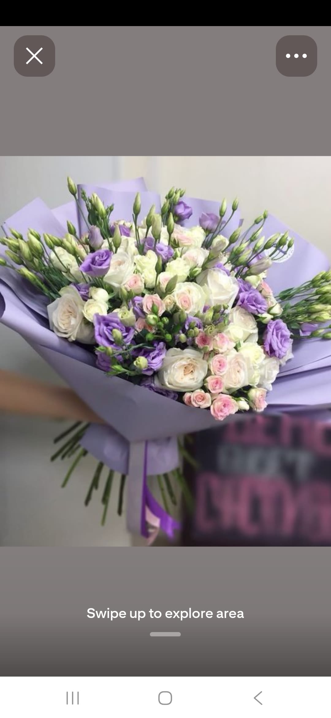 PURPLE FOREST - Lavender lisianthus and clustered white roses create a soft, romantic statement in this hand-tied flower arrangement-perfect as an anniversary bouquet, a wedding gift, or a thoughtful way to say you're thinking of someone. The purple, white, and pink palette reads gentle and refined so the recipient will feel truly cherished the moment the wrapping is untied.  This arrangement mixes full white roses, delicate lavender lisianthus, and petite pink spray roses in a rounded, abundant composition. Long lisianthus buds extend above the main blooms for a light, airy silhouette, while a lavender bouquet wrap and matching ribbon finish the presentation, giving it a polished, gift-ready look.  Give to the person you want to celebrate-whether marking a milestone or offering comfort, this bouquet feels intimate and elegant. Hand-tied and wrapped for easy display, the arrangement arrives ready to place in water; trim stems and change the water regularly to keep blooms fresh longer.