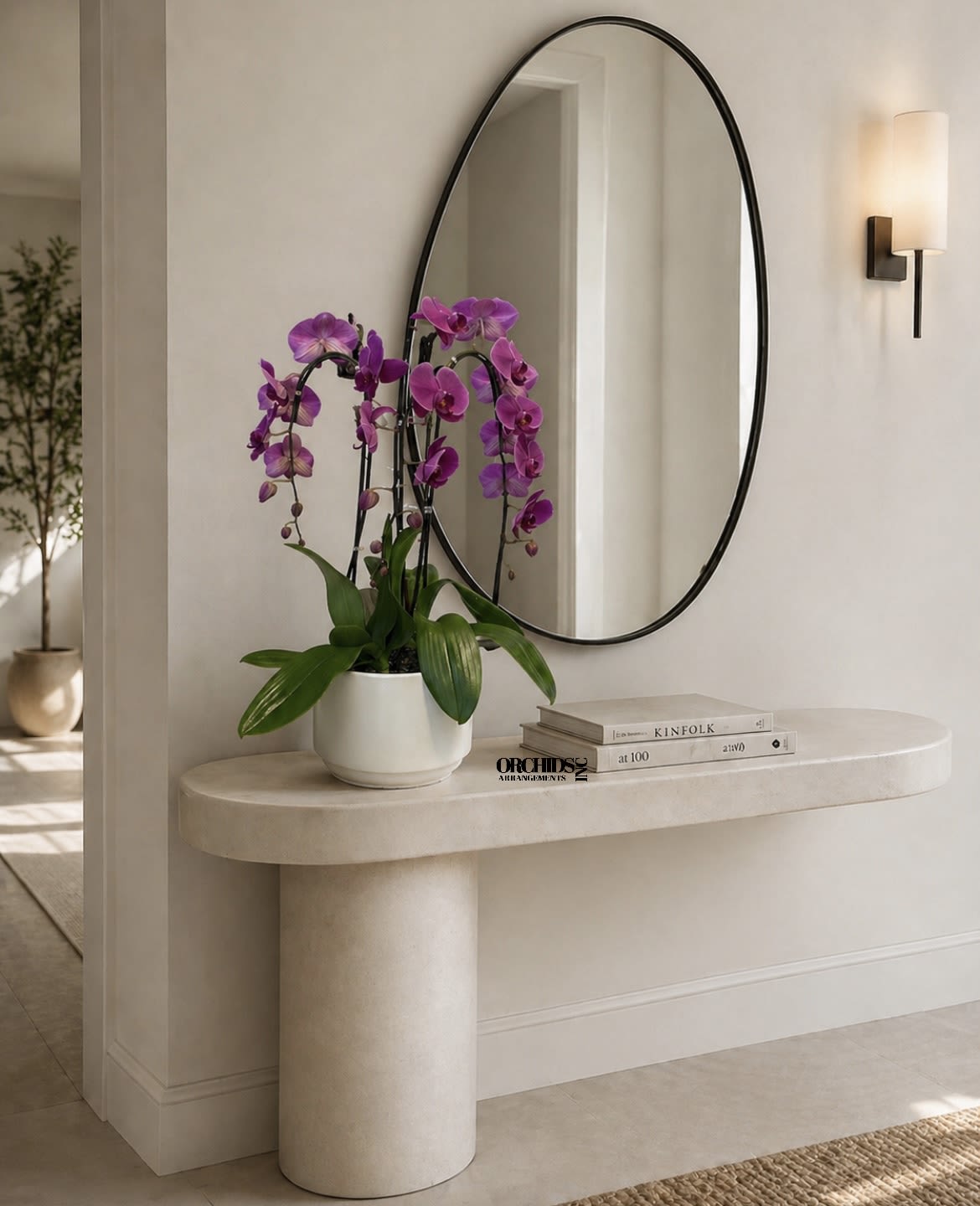 Purple orchids in a white pot on a stone console table
