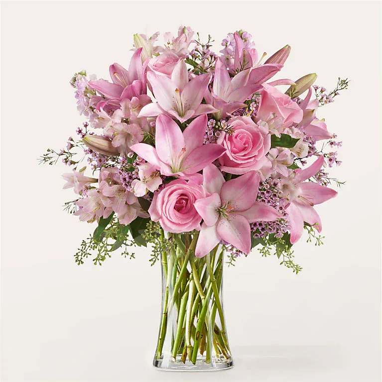 Gentle Gesture Bouquet - These thoughtfully curated pink florals show appreciation, love or sympathy with a touch of elegance.  Bloom Details Rose Lily Alstroemeria Stock Eucalyptus