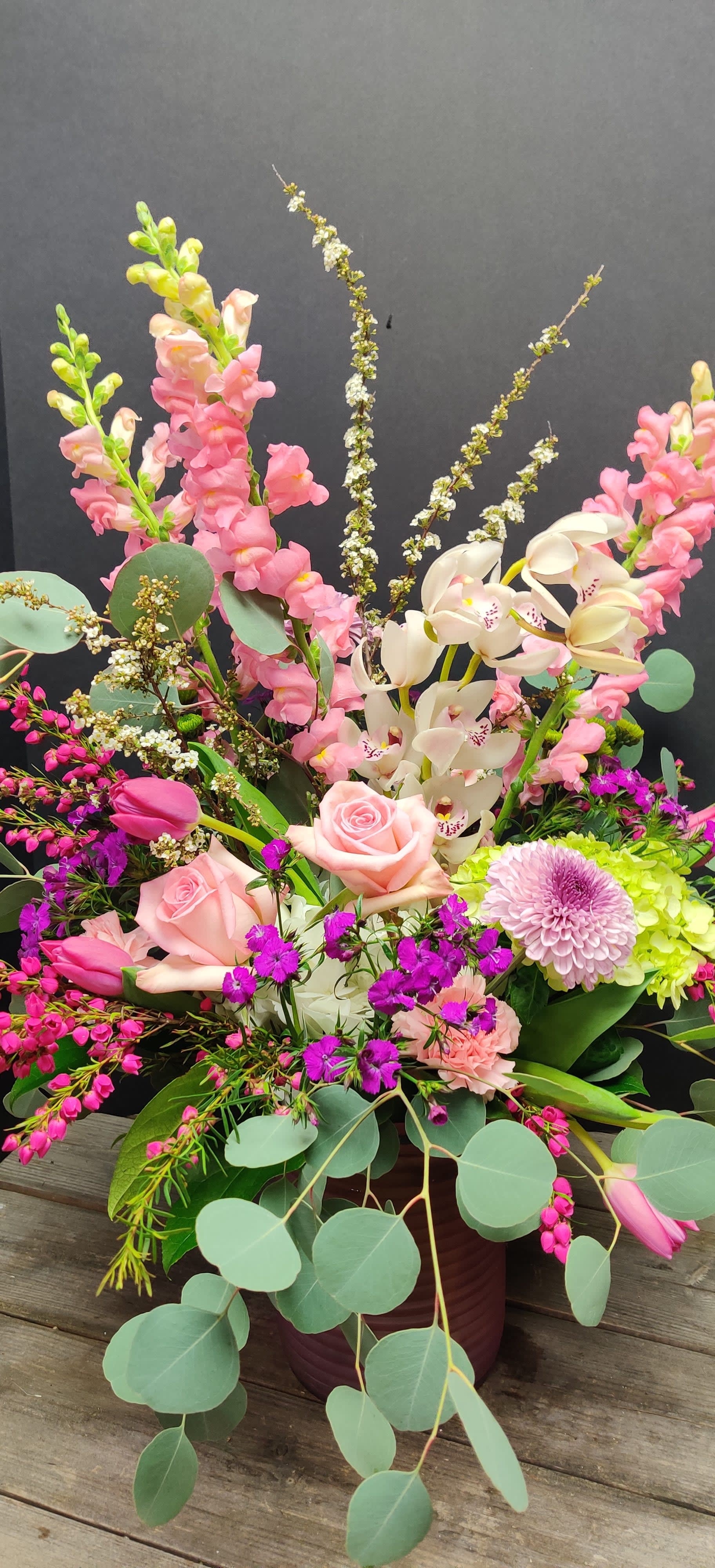 Best Mom Ever - A great mix of blooms with orchids all in a reusable container