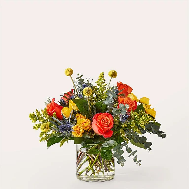 Disco Bouquet - Party on with this fiery blend of orange and yellow blooms, an excellent way to share birthday wishes, a get well or make their day brighter.  Bloom Details Eucalyptus Solidago Rose 