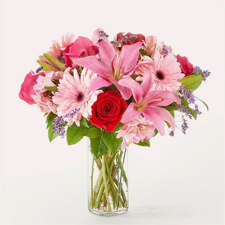 Lots of Love Bouquet - Lots of Love is headed their way in this enchanting mix of red and pink blooms!  Bloom Details Rose Alstroemeria Lily Gerbera Daisy 