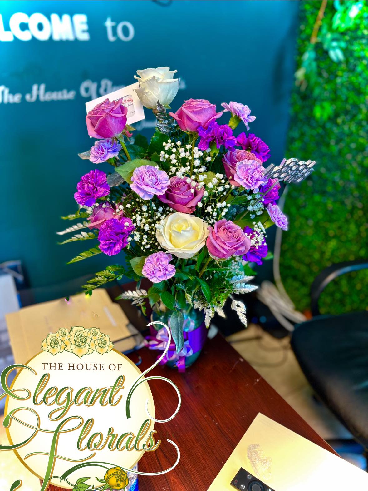 Bouquet of pink, purple, and white roses in a vase
