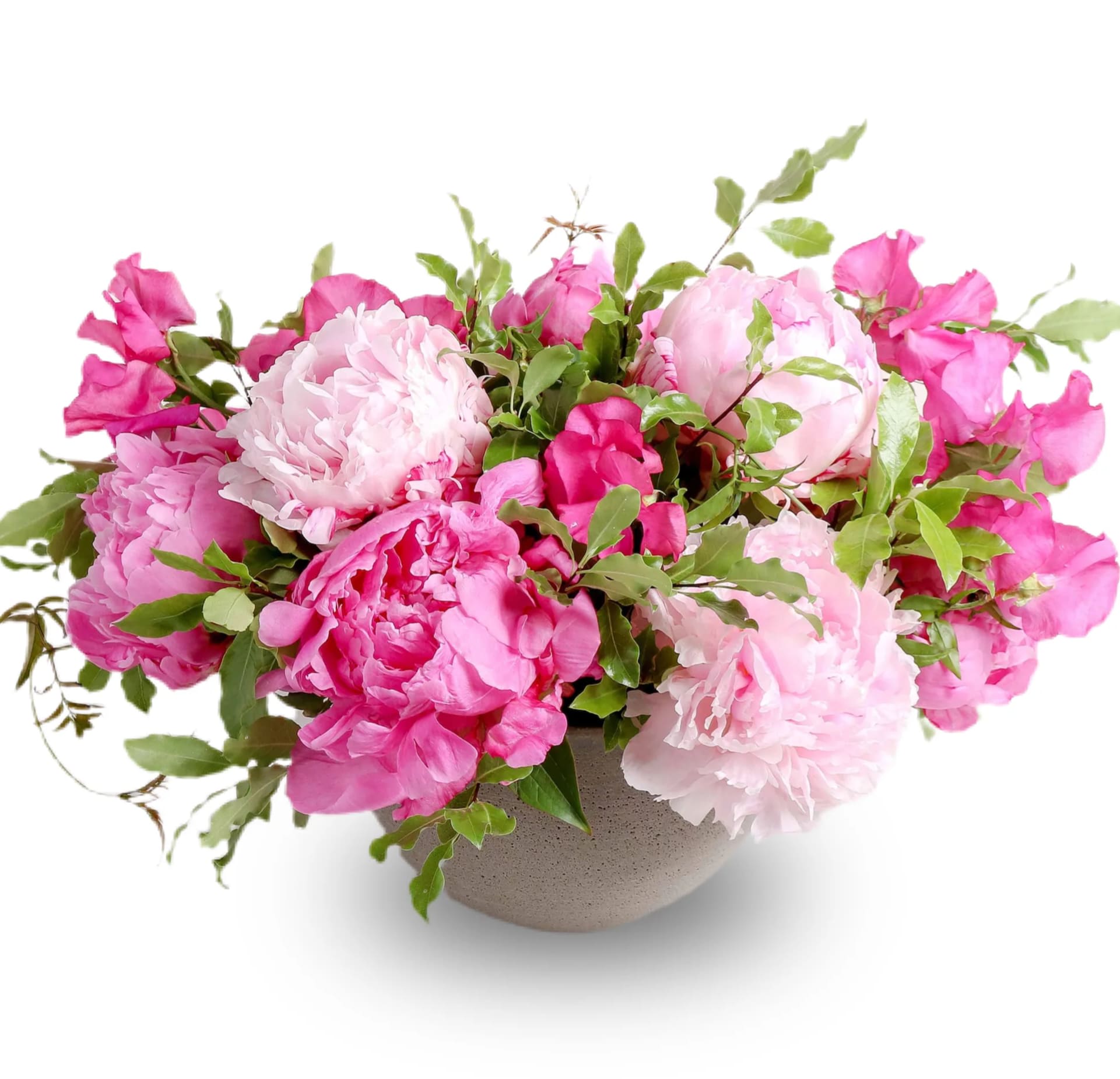 Pink peonies arranged in a low gray bowl vase