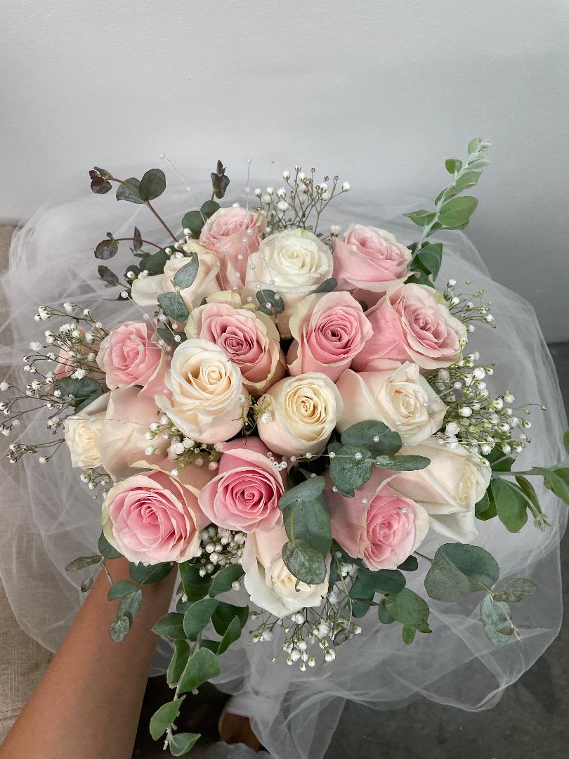 Pink and white rose bouquet with baby's breath and eucalyptus