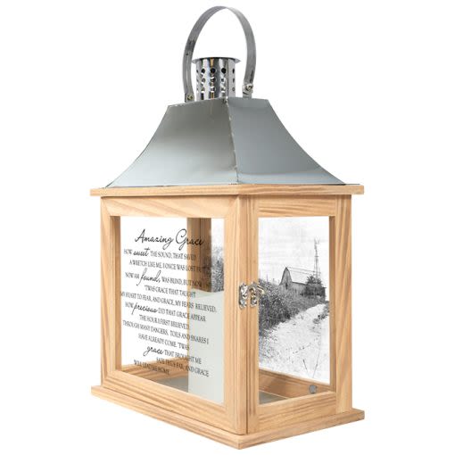 LANTERN LARGE "AMAZING GRACE" - Our Memorial Lanterns are made from quality composite wood and a stainless steel copper finish top. They feature a built-in automatic timer which runs for 6 hours on and 18 hours off. DO NOT use fire burning candles in the lanterns. Suitable for hanging or free-standing use inside or outside. Recommended as an accent in floral arrangements for many occasions! Meant for indoor use. E: 12.25" H: 17" D: 7.125"