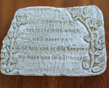 Memorial plaque with raised floral border and engraved sympathy verse