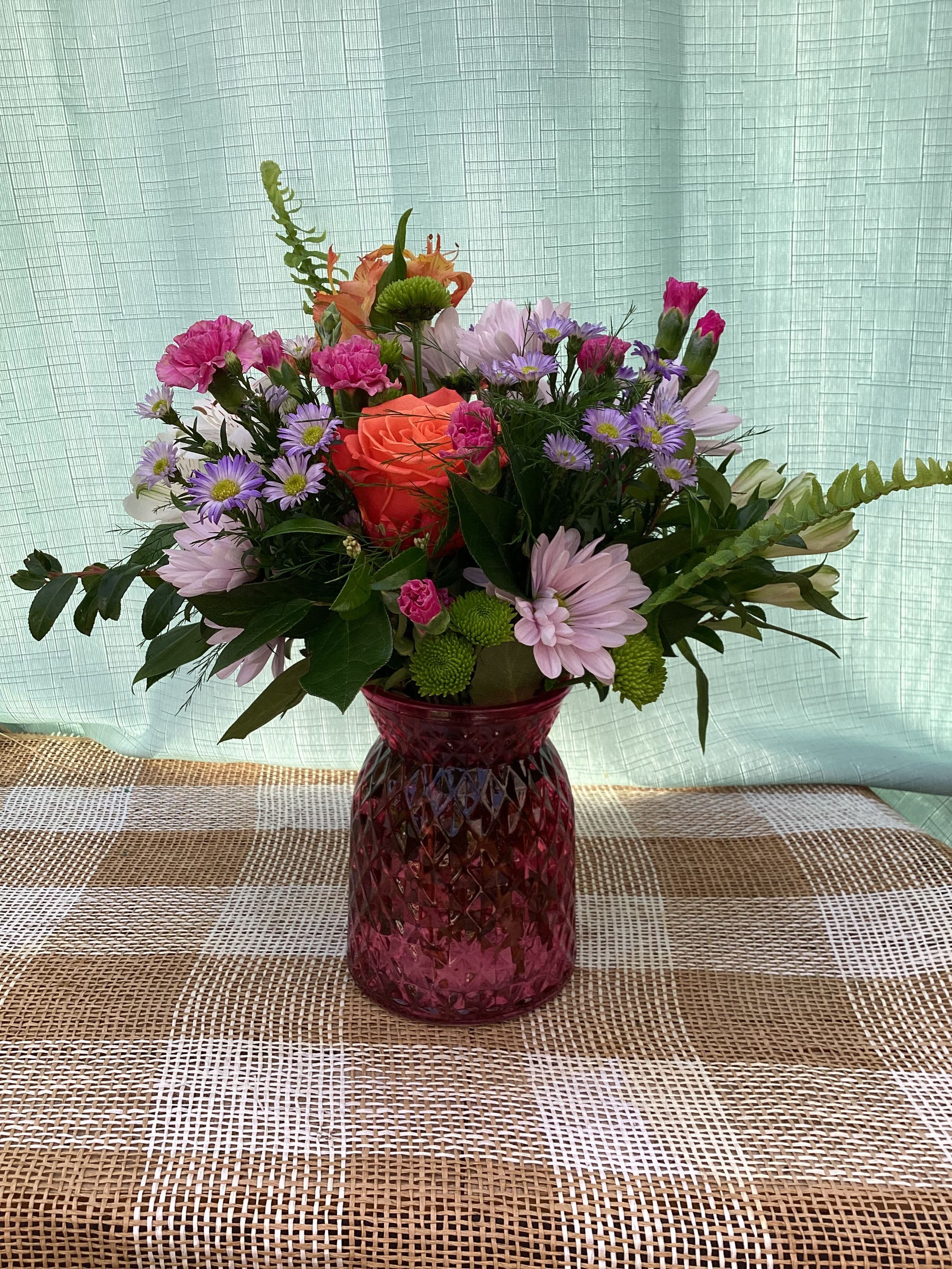MOTHER'S DAY CELEBRATION - A stunning arrangement for Mother's Day in a decorative, colorful vase