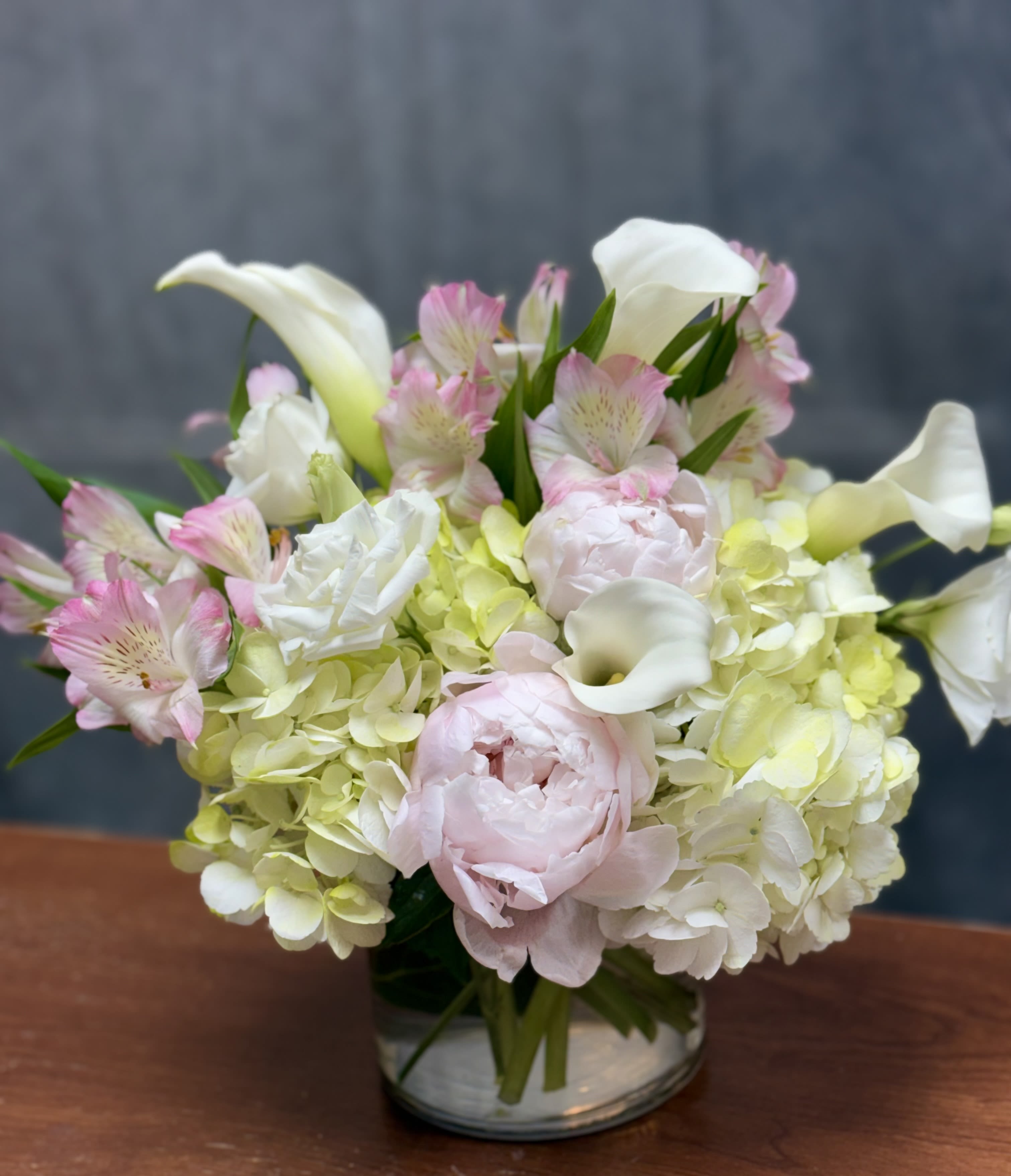 Luxe Blooms vase - An elegant blend of hydrangeas, peonies , calla Lilies and other beautiful blooms designed with soft textures and a luxurious feel  Perfect for all occasion and timeless moments 