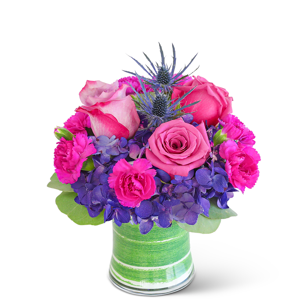 Pink roses and purple flowers in a green striped vase