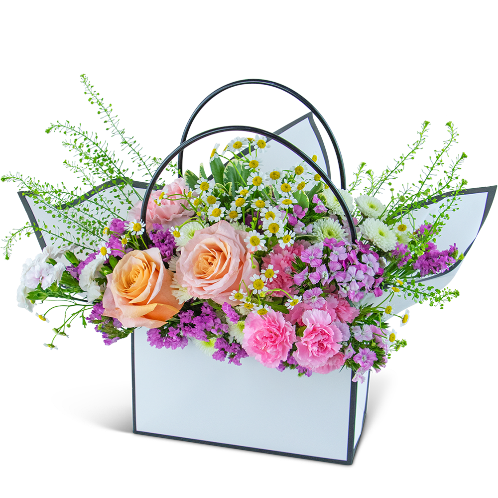 Seasonal Garden Blooming Tote - Experience the beauty of the changing seasons with our Seasonal Garden Blooming Tote. This enchanting arrangement features our freshest seasonal blooms, ensuring a delightful variety that may differ from the picture but maintains the highest quality and value. Designed in a stunning Flower gift tote bag, it not only looks visually appealing but also makes for easy carrying and delivery, allowing you to send the perfect flower gift directly to someone's home or office.