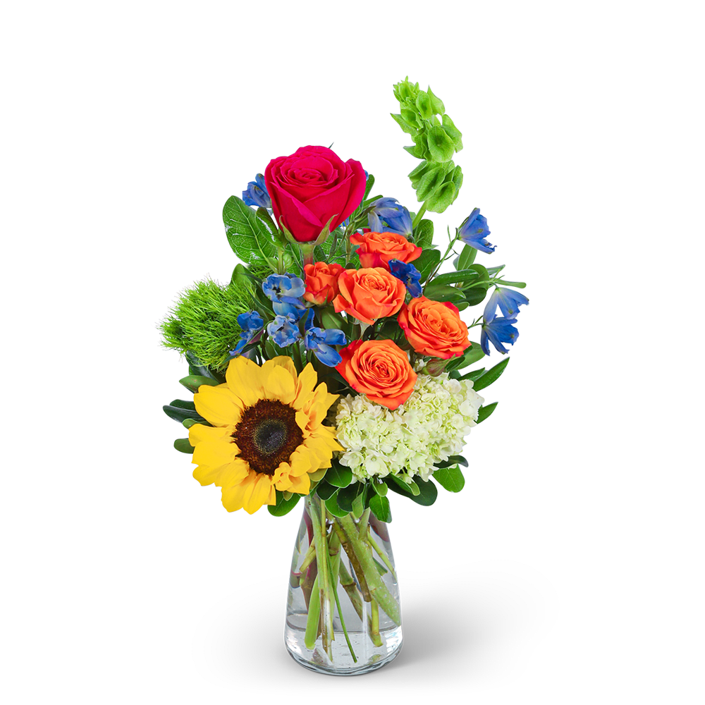 Mixed bouquet in a clear glass vase with a sunflower and roses