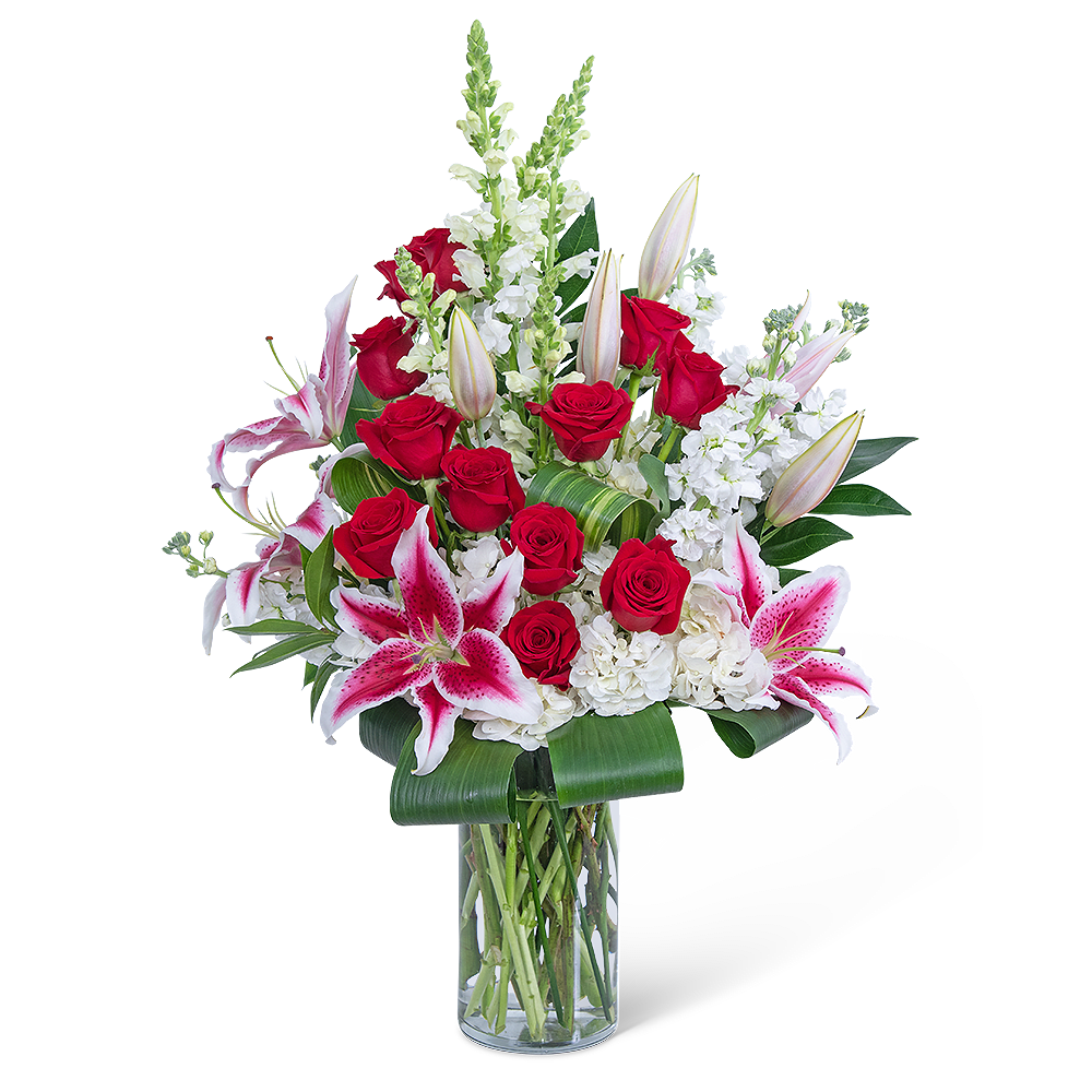 Endless Love Story - Endless Love Story is a "wow" arrangement! It is ultimate beauty and perfection! It features a dozen roses, Lilies, Hydrangea, Snapdragons, Stock, Aspidistra, and other premium foliage. Roses symbolize love and hope and are the perfect anniversary gift. Lilies symbolize happiness and purity of heart, which makes this design a shop and customer favorite.